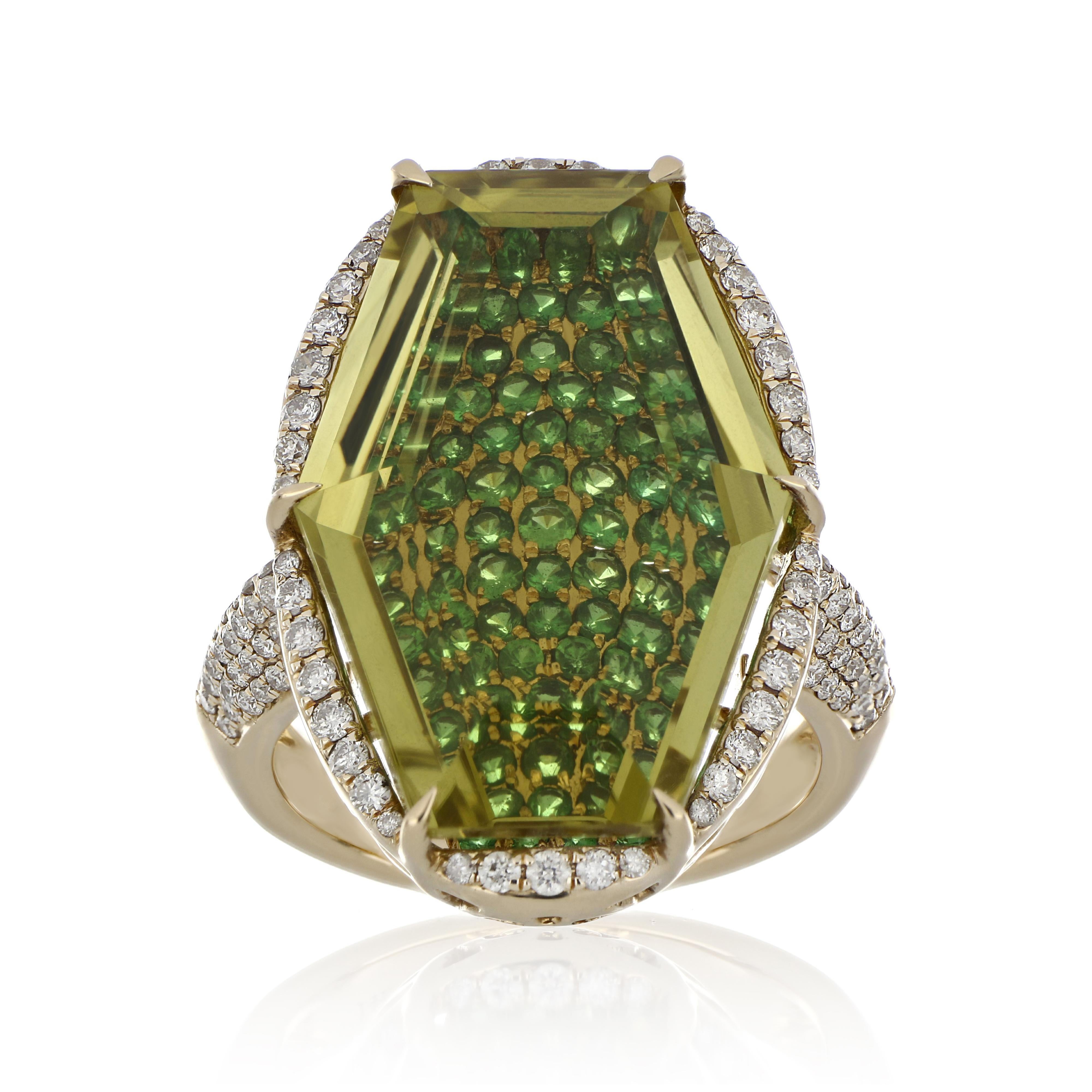 14 Karat Yellow Gold ring studded with fancy cut 23.9 x 15.8 mm 19.67 Ct Lemon Quartz,  with unique under stone setting of 1.44 Cts Tsavorite, accented with 0.73 Ct Diamond. Beautifully hand crafted in 14 Karat Yellow Gold.

Stone Details:
Lemon