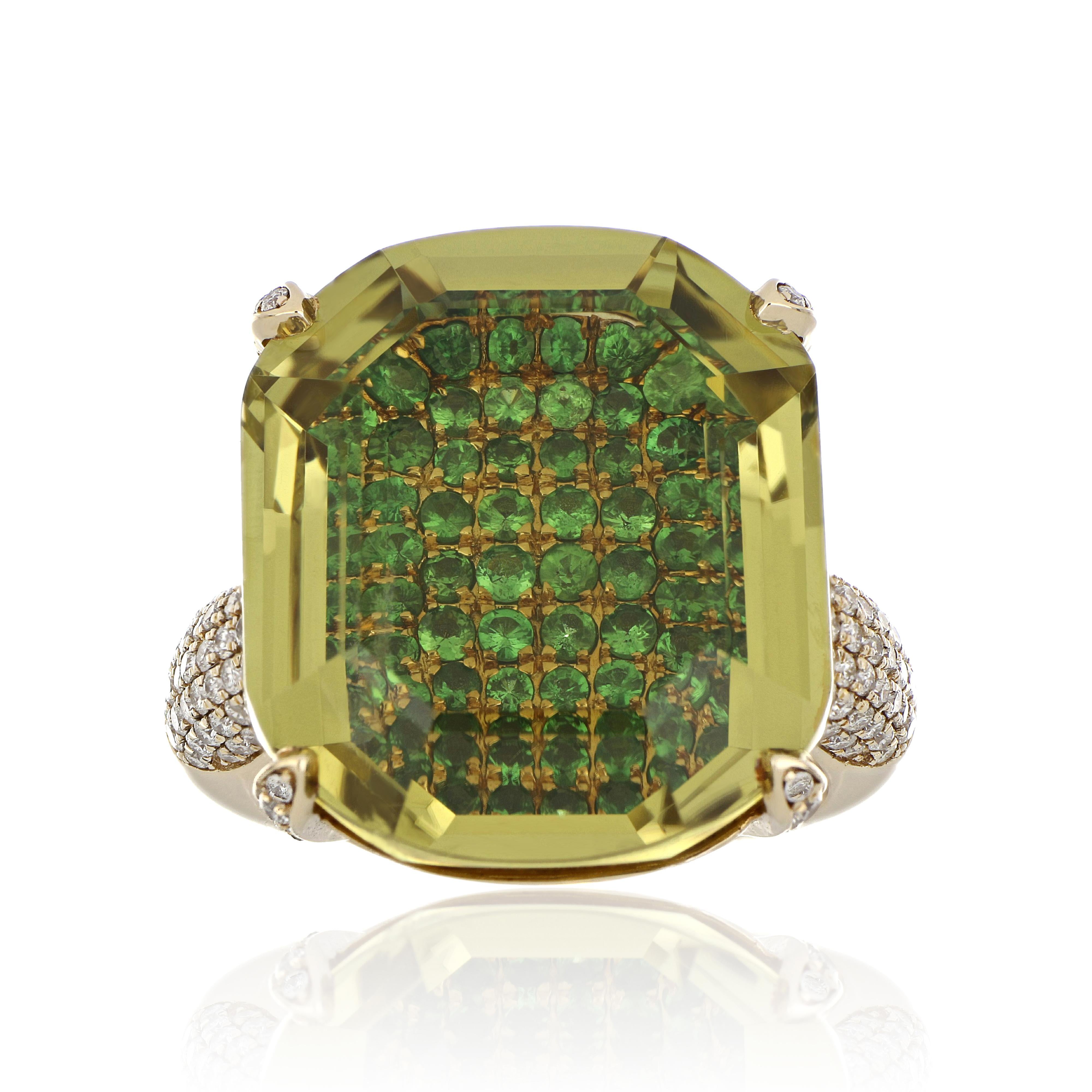 14 Karat Yellow Gold ring studded with Fancy Hexagon Cut  24.39 Ct Lemon Quartz,  with unique under stone setting of 1.11 Ct Tsavorite accented with 0.51 Cts Tsavorite. Beautifully hand crafted in 14 Karat Yellow Gold.

Stone Details:
Lemon Quartz: