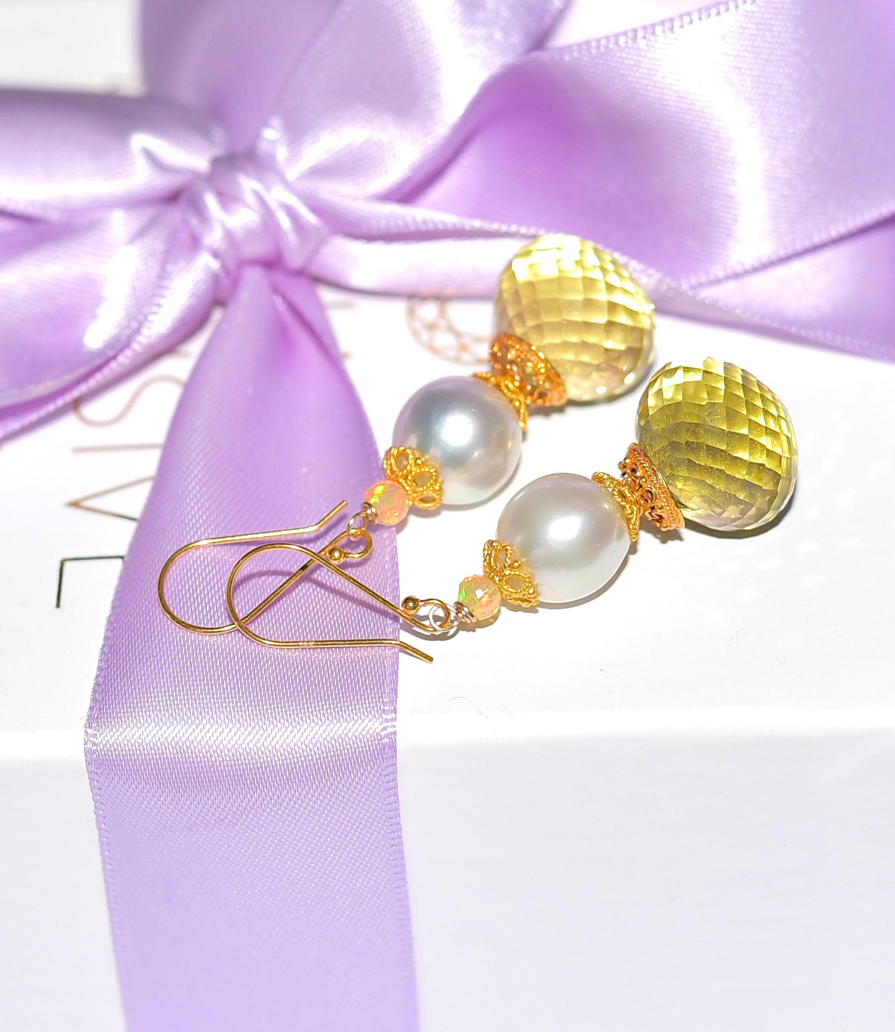 Summery, bright, and shiny! Simple and everyday sun-tone earrings are decorated with 18K Solid Yellow Gold details. The pearl adds elegance and the small opal beads add character.

Lemon Quartz 15mm
South Seal Pearl 12mm 
Opal beads 3mm 

Total