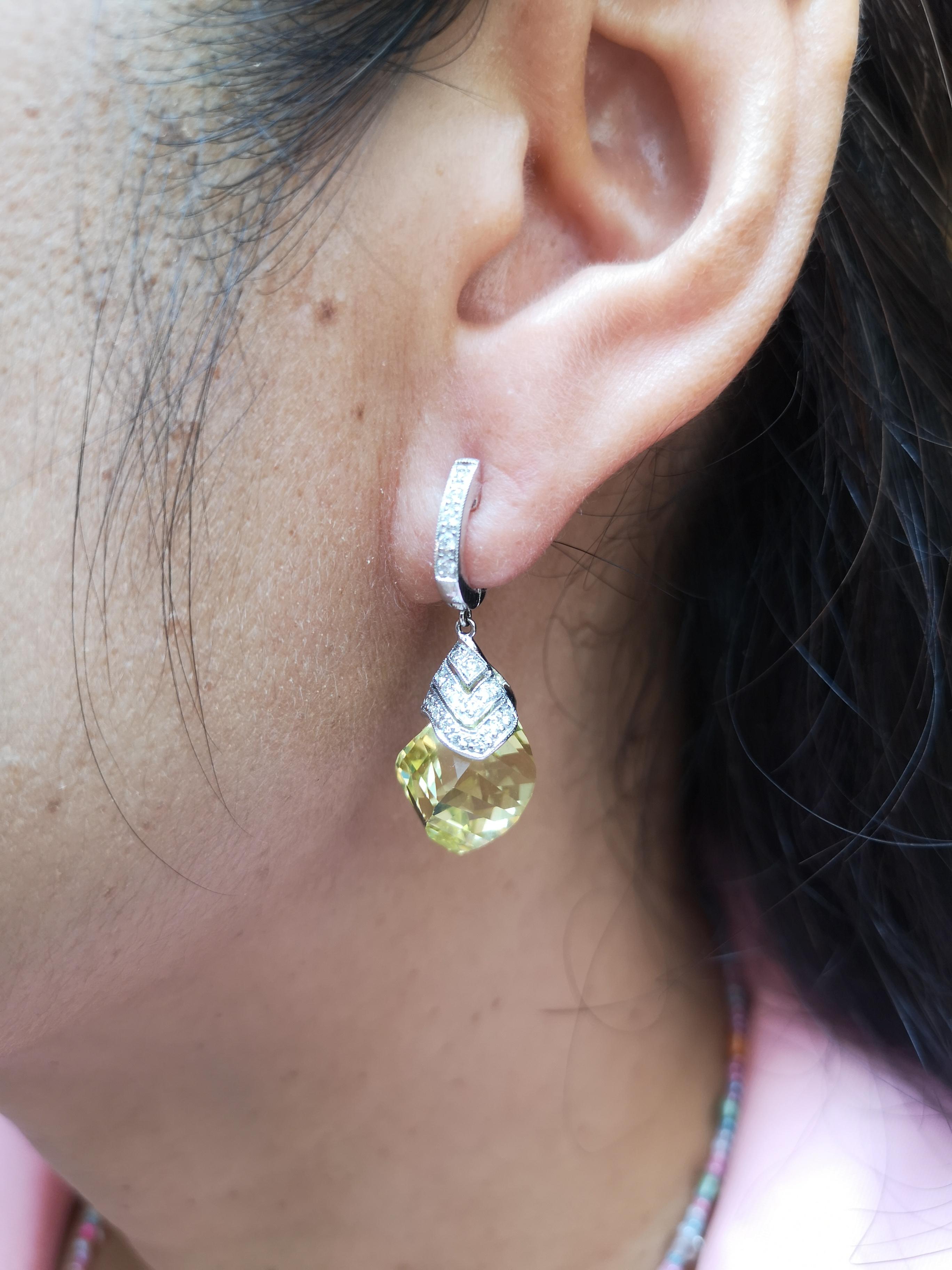 Lemon Quartz 22.17 carats with Diamond 0.35 carat Earrings set in 18 Karat White Gold Settings

Width: 1.3 cm
Length: 3.2 cm 

