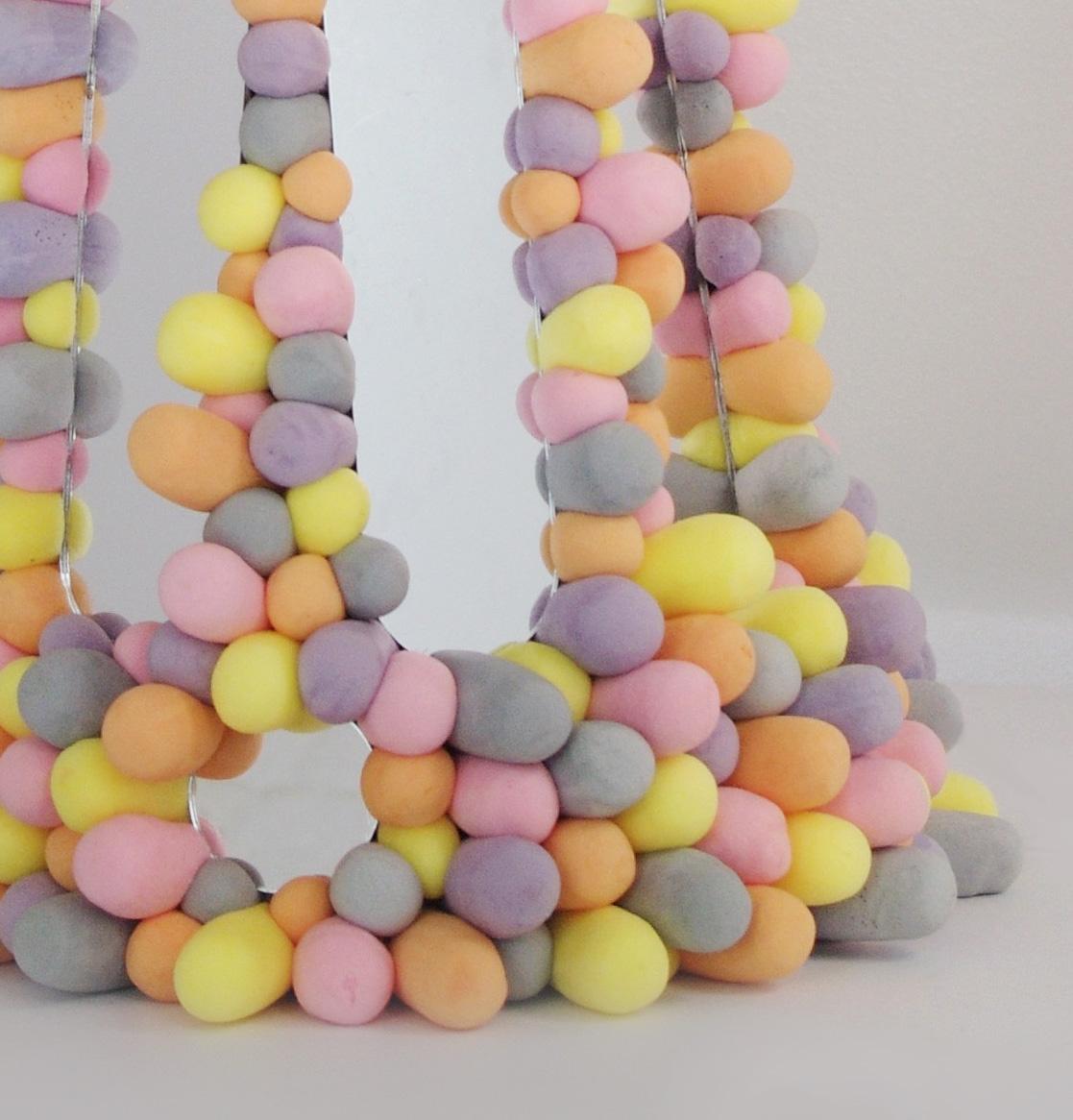 Table mirror inspired by a zoetrope and assembled from individually cast expandable foam pieces.