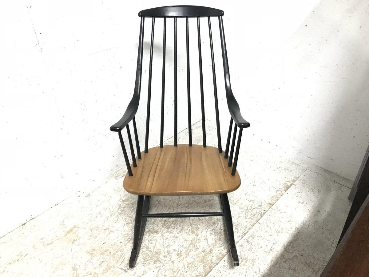 Lena Larsson, manufactured by Nesto.
A Mid Century Modern Swedish Grandessa rocking armchair with fine ebonized turnings to the back and below the ebonized sculpted arms with a show wood Beech seat and ebonized legs, stretchers, and rockers. The