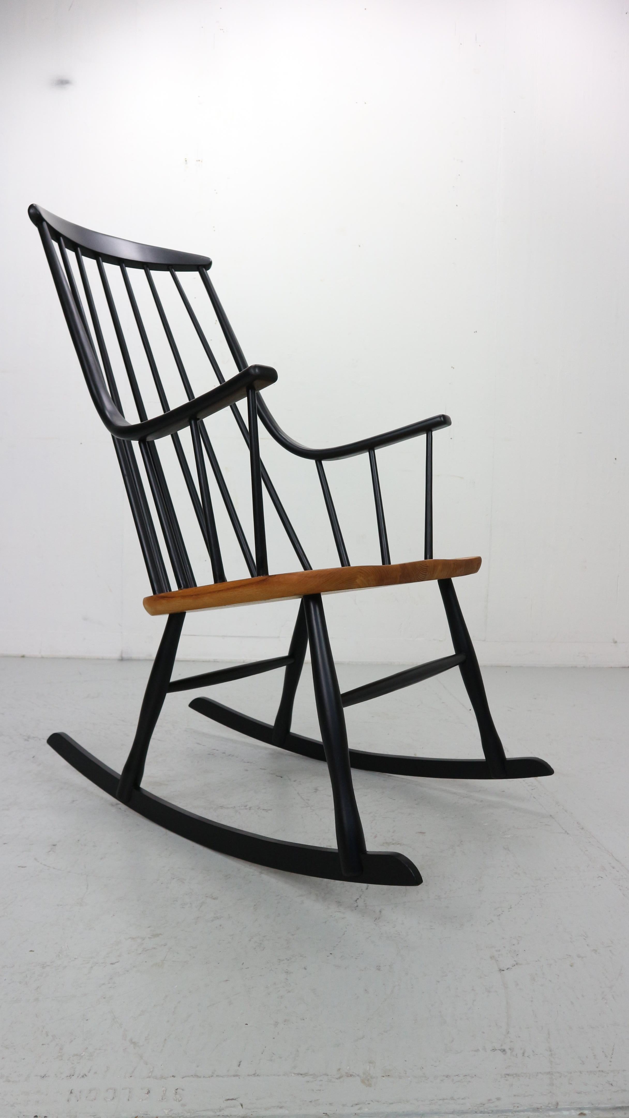Mid-Century Modern Lena Larsson, made by Nesto, a mid century rockingchair with sculptural arms