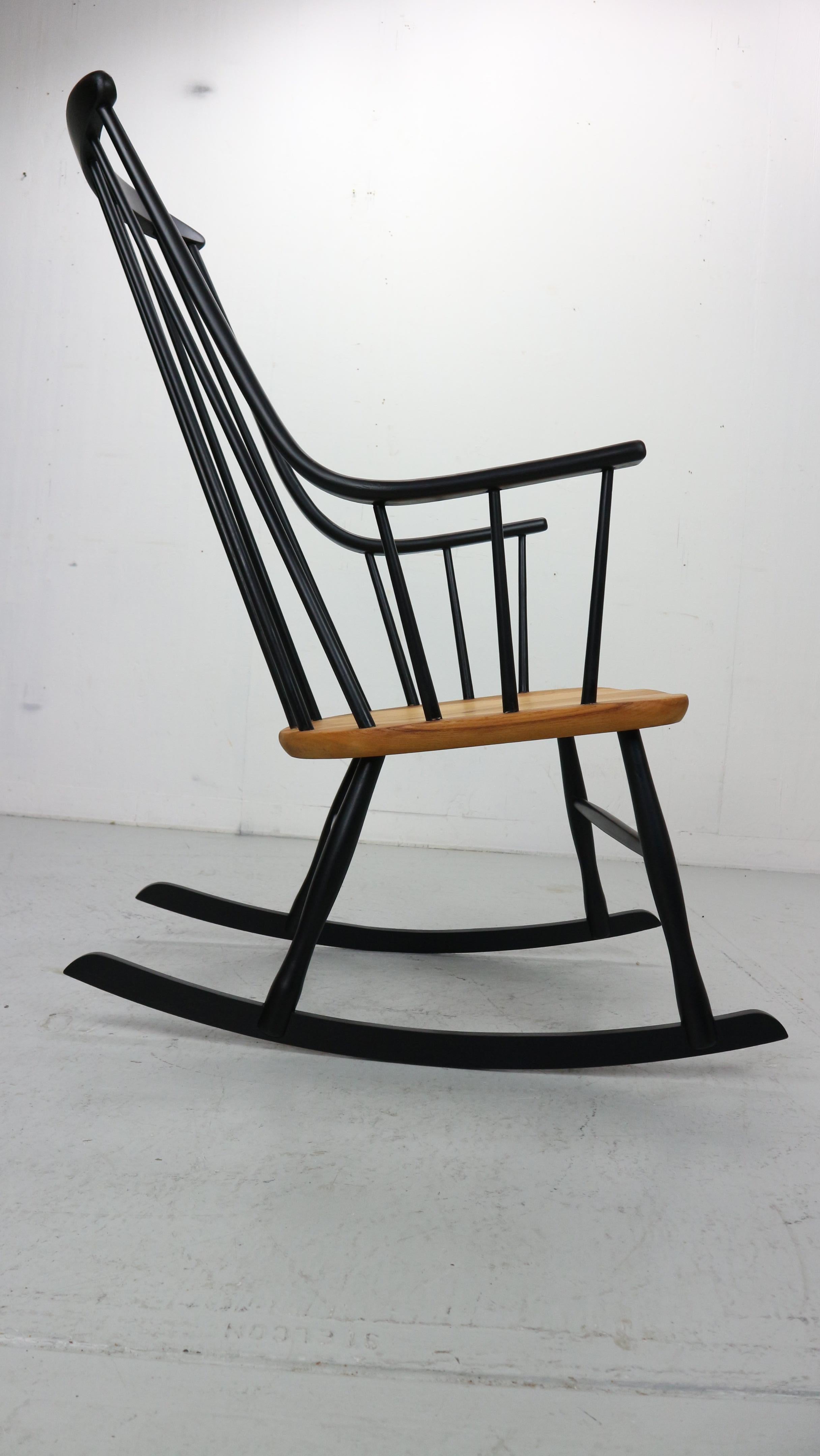 Swedish Lena Larsson, made by Nesto, a mid century rockingchair with sculptural arms