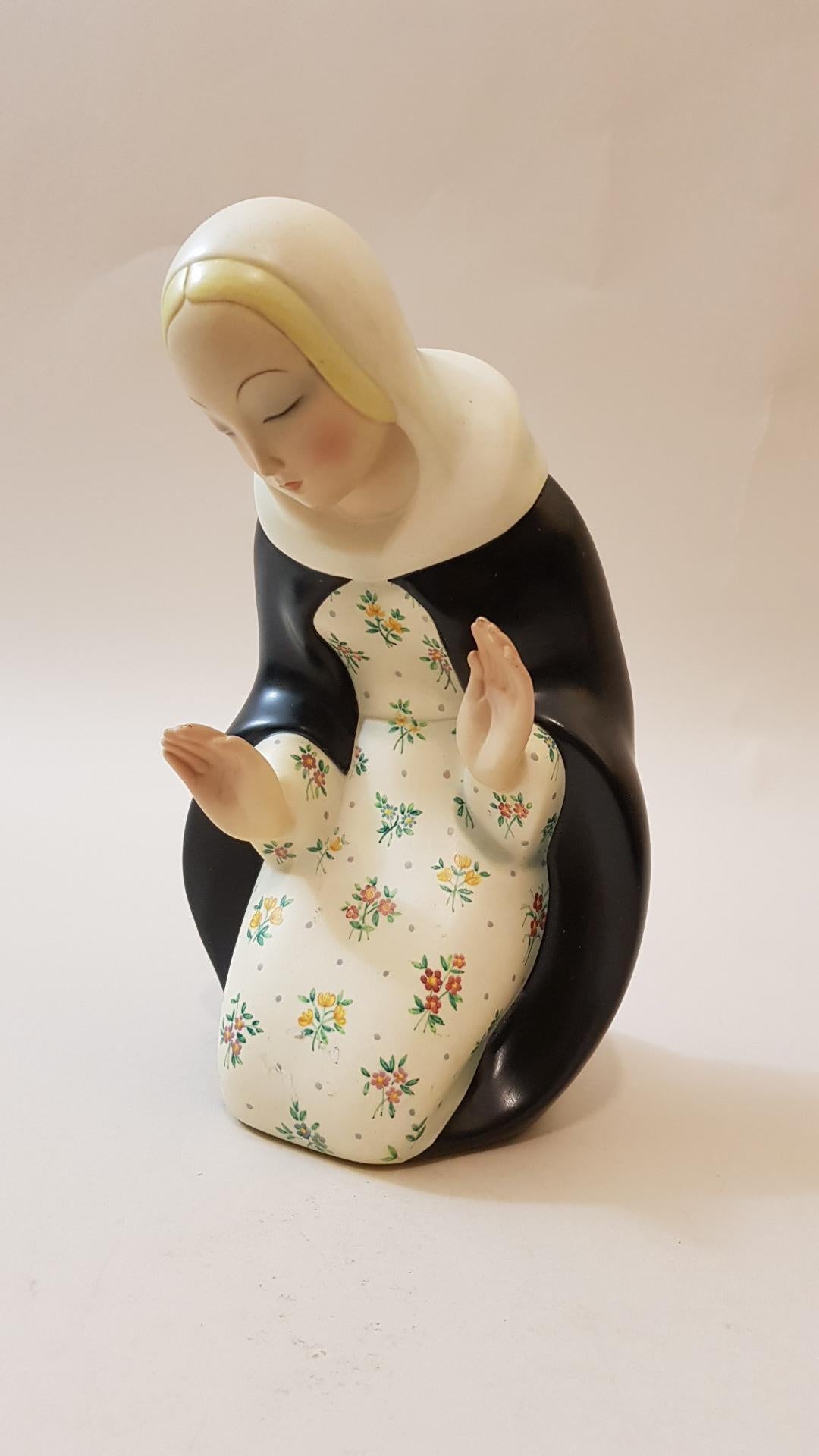 Madonna ceramic with flower decorated dress

Under the signed, dated base and symbol of the decorator.

Published: Alfonso Panzetta 