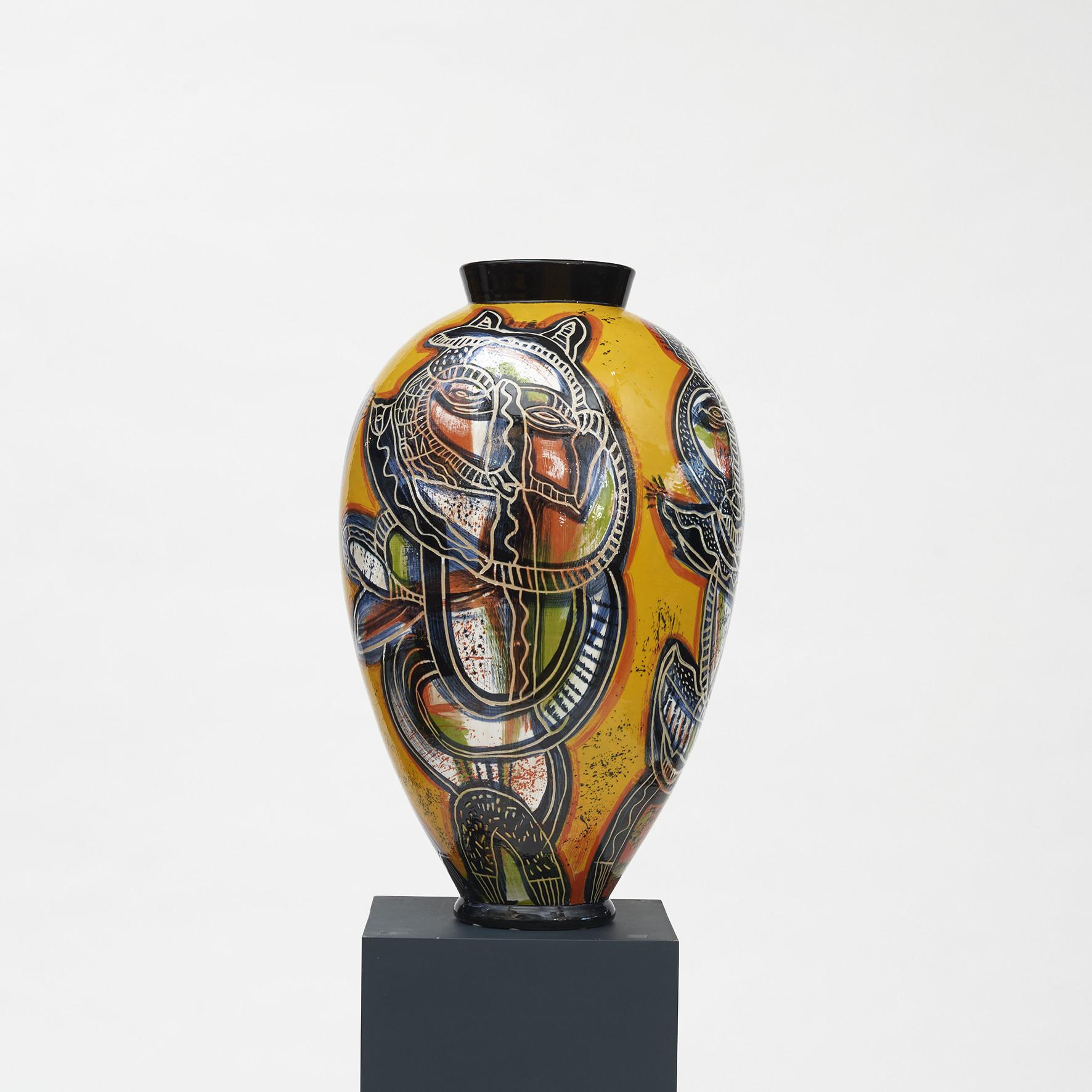 Lene Regius, born 1940. Danish ceramicist and artist.
Colossal stoneware vase. Unique, one of a kind.
Decorated with motifs inspired by African cultural history and COBRA, (or CoBrA), a European avant-garde art movement. Glazed in saturated, warm