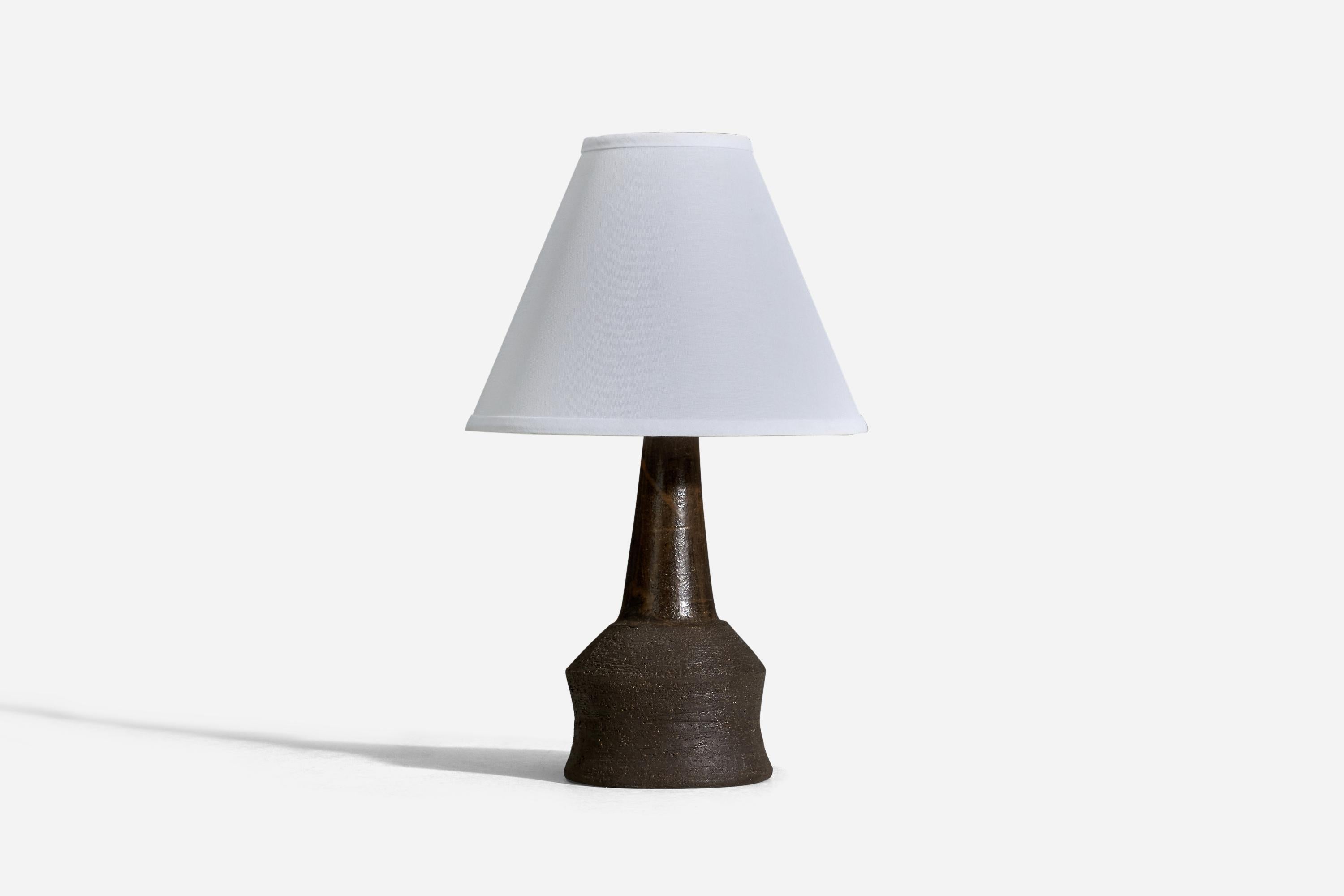 A brown glazed stoneware table lamp designed and produced by Lene Rykke, Denmark, 1960s. 

Sold without lampshade
Dimensions of lamp (inches) : 12 x 5.25 x 5.25 (Height x Width x Depth)
Dimensions of lampshade (inches) : 4 x 10 x 8 (Top Diameter