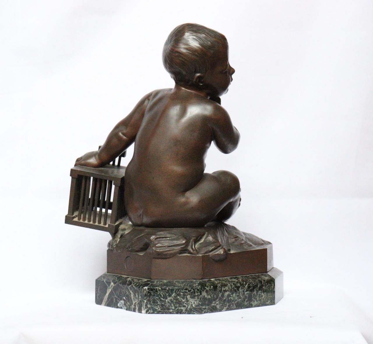 Patiné « L'Enfant la Cage », une figurine en bronze du 19ème siècle d'après Jean-Baptiste Pigalle