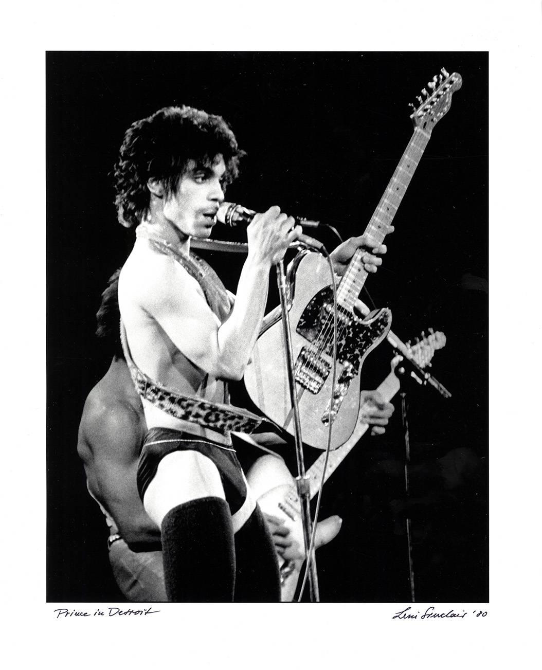 Prince Detroit 1980:
A standout, hand signed photograph of the late all-time great Prince, shot by legendary Detroit photographer Leni Sinclair, 2016's Kresge Foundation's Eminent Artist of 2016 (See The Guardian UK Photo Section, Jan. 28, 2016):