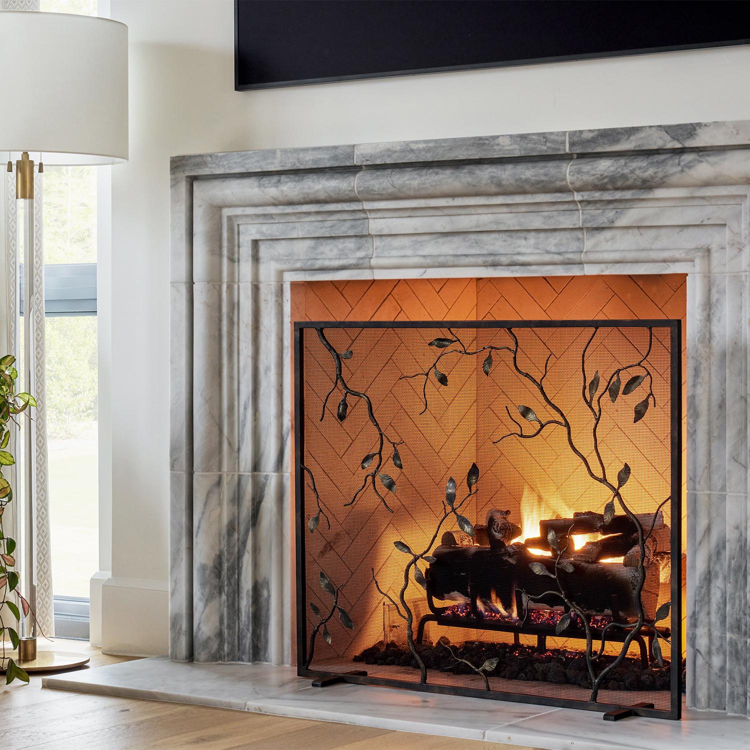 Inspired by the delicate beauty of crinkled autumn leaves, the Lennox fireplace screen adds a seasonally warm character to home's coziest spot: the fireplace. The beauty of texture created by hand comes across in this one of a kind design, with no