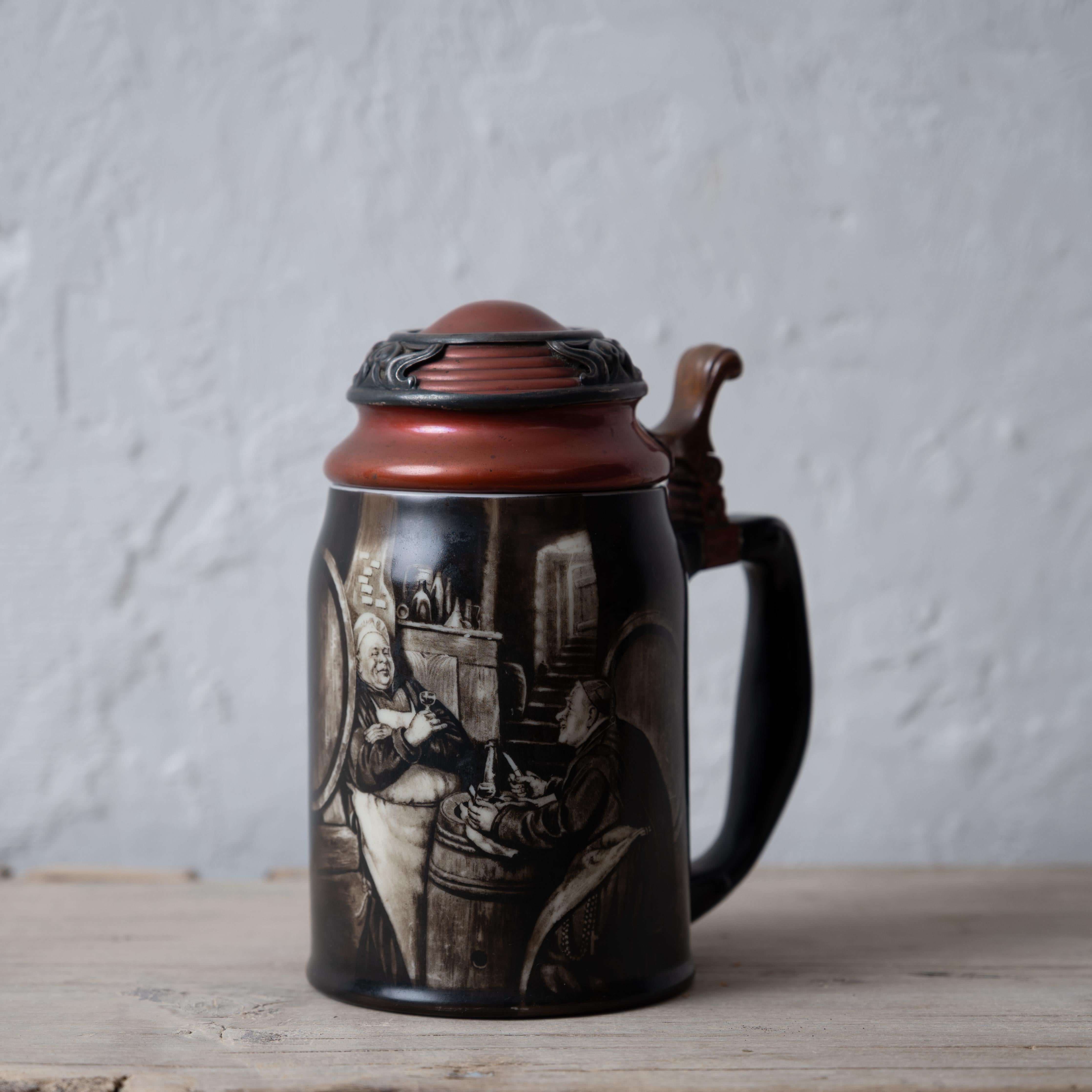 A stein by the Ceramic Art Company/ Lenox with transfer image of monks and mounted with sterling and copper, circa 1900.

5 ½ inches wide by 3 ¾ inches deep by 6 ¾ inches tall



