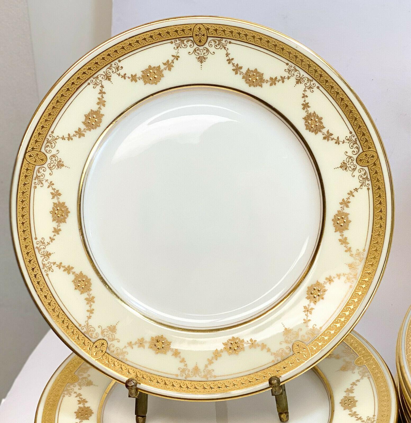 36-piece Lenox porcelain dinner service for 12, pattern B10, circa 1910. Gilt laurel leaf swags around the rim with beaded jewels. Limoges mark to the underside.

The service includes 
- 12 bread & butter plates
- 12 salad plates
- 12 dinner