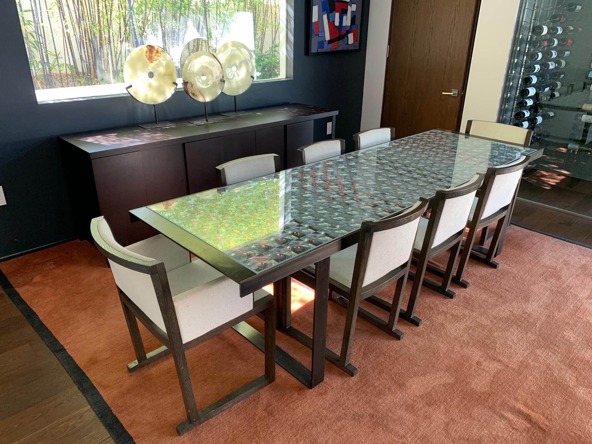 Beautiful dining table designed and manufactured in Italy by Patricia Urquiola for B&B Italia.
The table shows well, the metal shows surface wear and loss to finish, there are scratches and it needs to be refinished, glass is intact and in