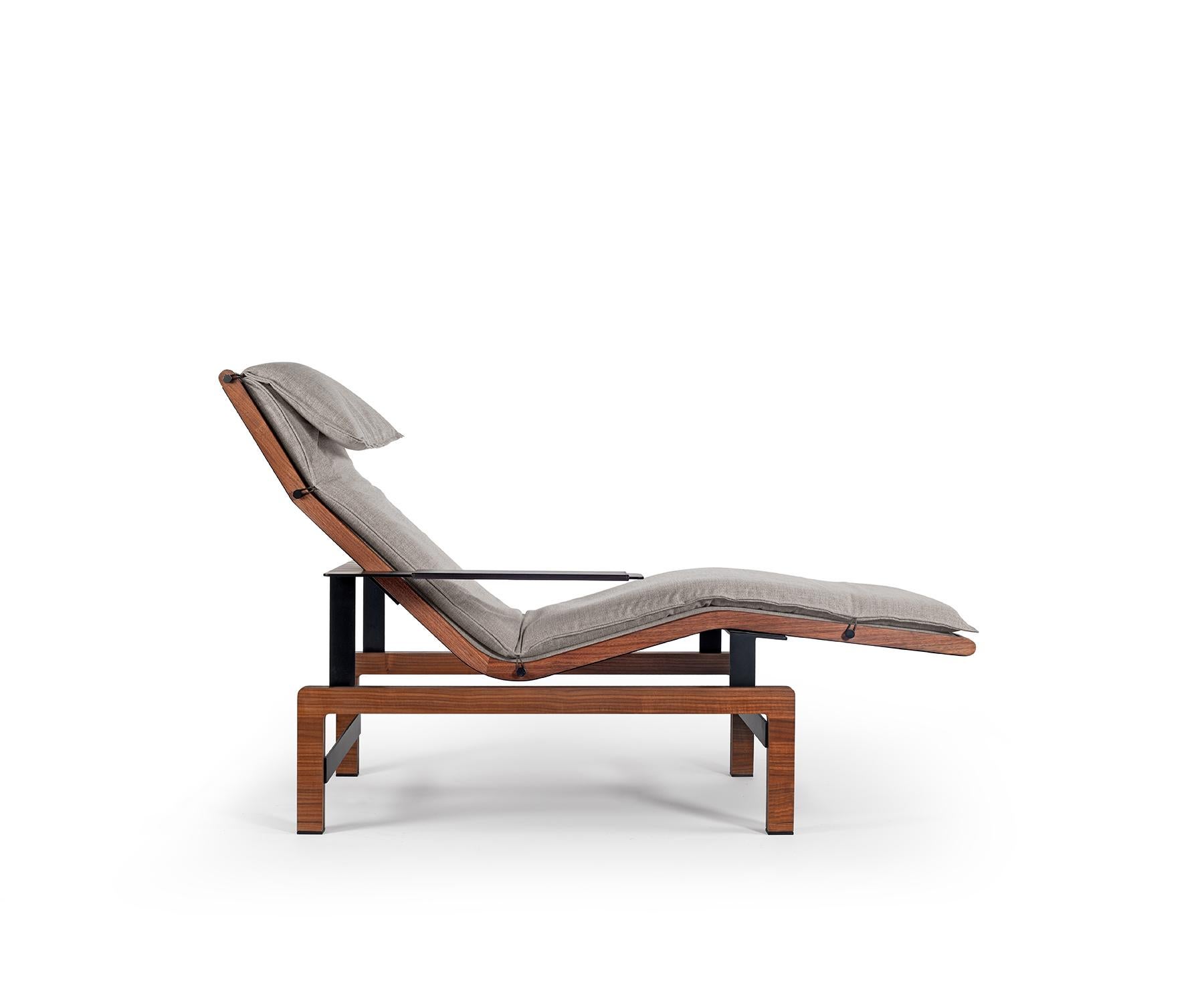 Inspired by moments of pause, the Lenta Lounger combines form, function, and comfort in a sleek design.

Its generous contours are upholstered in soft fabric, with streamlined arms, a supportive recline, and a crafted wood frame that grounds it with