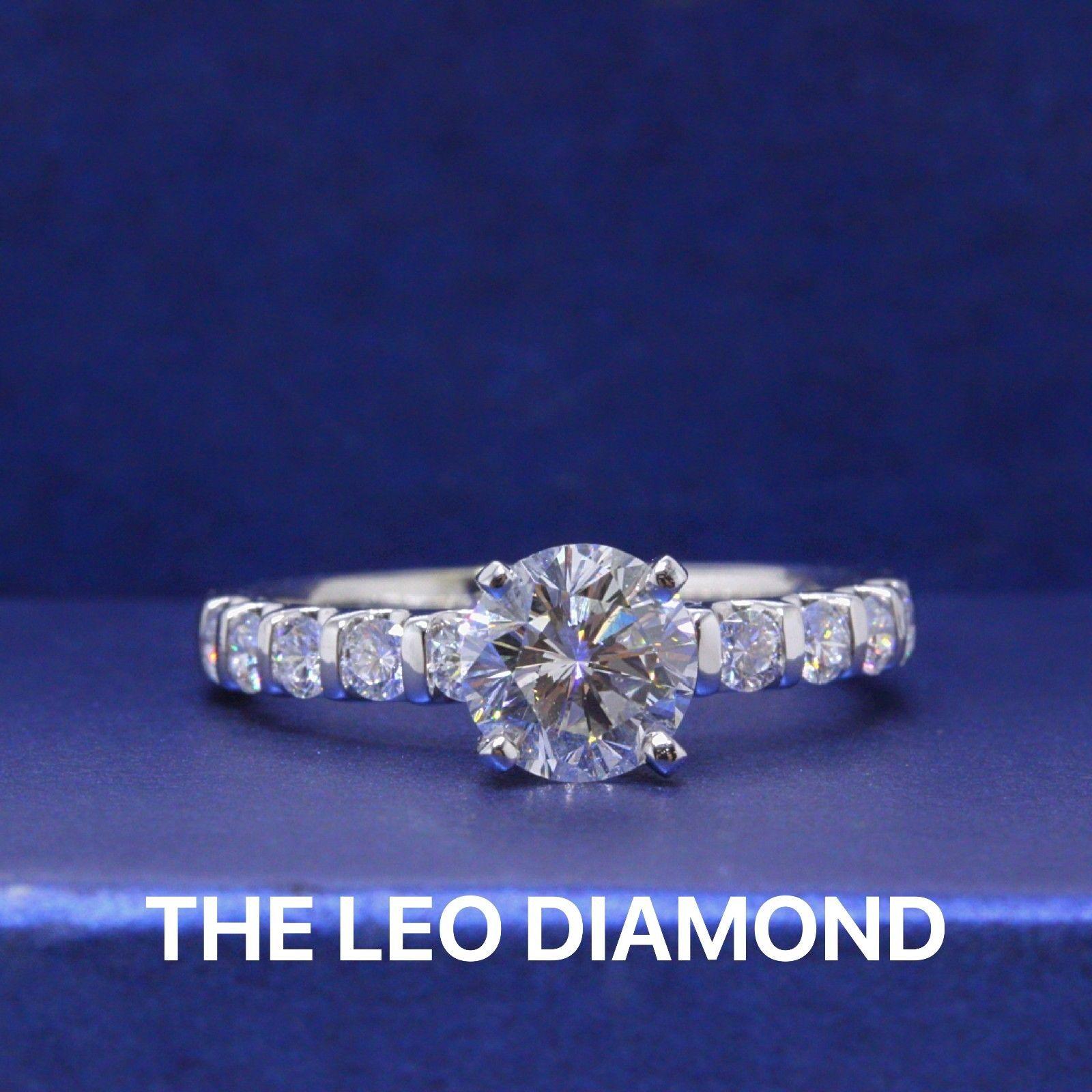 THE LEO DIAMOND 
Style:  LEO Solitaire with Diamond Band Design
Serial Number:  LEO 005576 Diamond - LEO 5061515 Setting
Certificate:  IGI # 32671691 & GSI # 4984000101
Metal: 14KT White Gold 
Size:  7.5 - Sizable
Total Carat Weight:  1.70