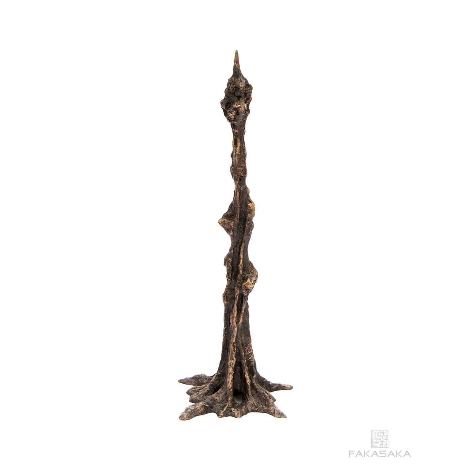 Leo candleholder by Fakasaka Design.
Dimensions: W 11 cm D 10 cm H 30.5 cm.
Materials: dark bronze.
Also available in polished bronze.

 FAKASAKA is a design company focused on production of high-end furniture, lighting, decorative objects,