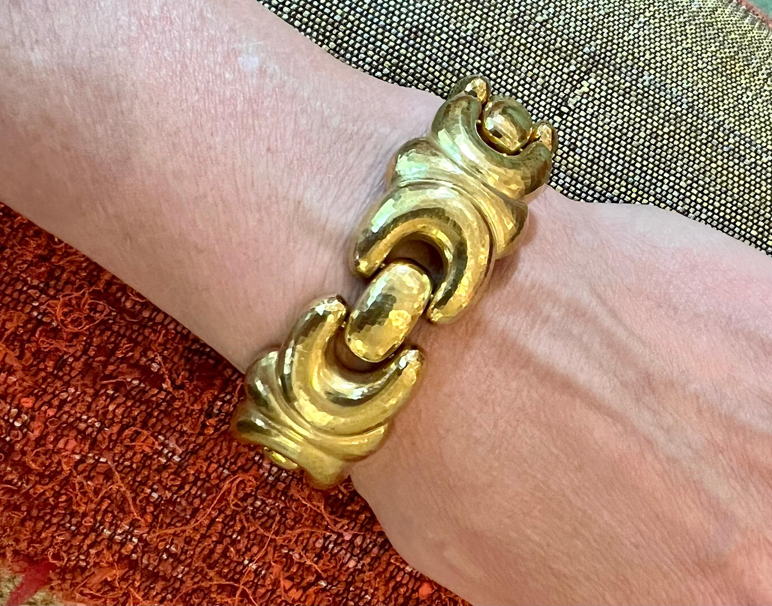 An unusually weighty (90 plus grams) 18 karat gold, hammered finish, puffed up, fancy floral  link bracelet with repousse design and box clasp closure,  by Leo de Vroomen. Signed de Vroomen (clasp), stamped LDV English Hallmarks London 750 letter