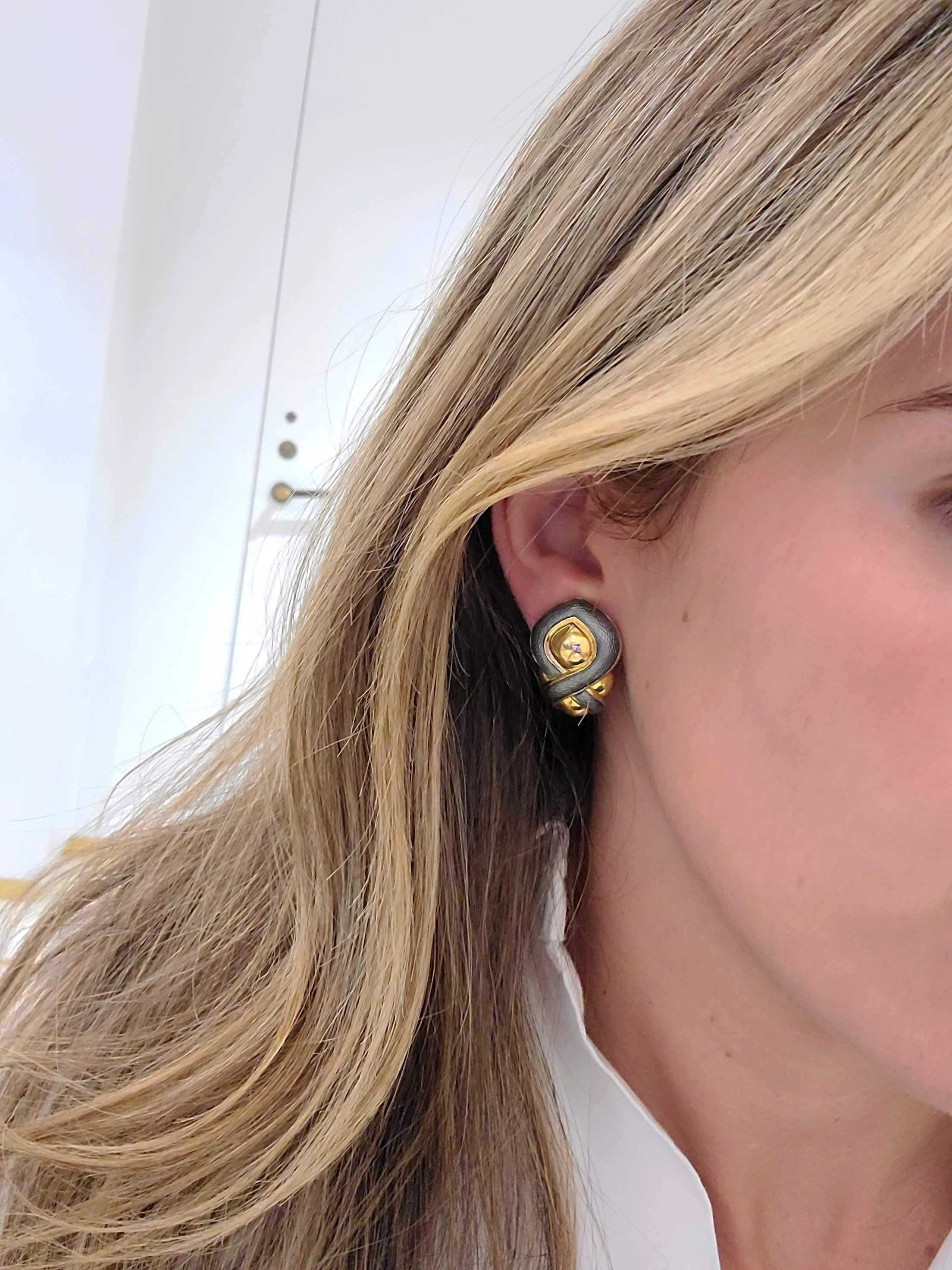 Started in 1967 by Leo and Ginnie de Vroomen the company is known for bold and innovative designs, along with exquisite enamel work.  Distinctive from the start, the renowned company is simply known as de Vroomen.
These 18 karat yellow gold earrings