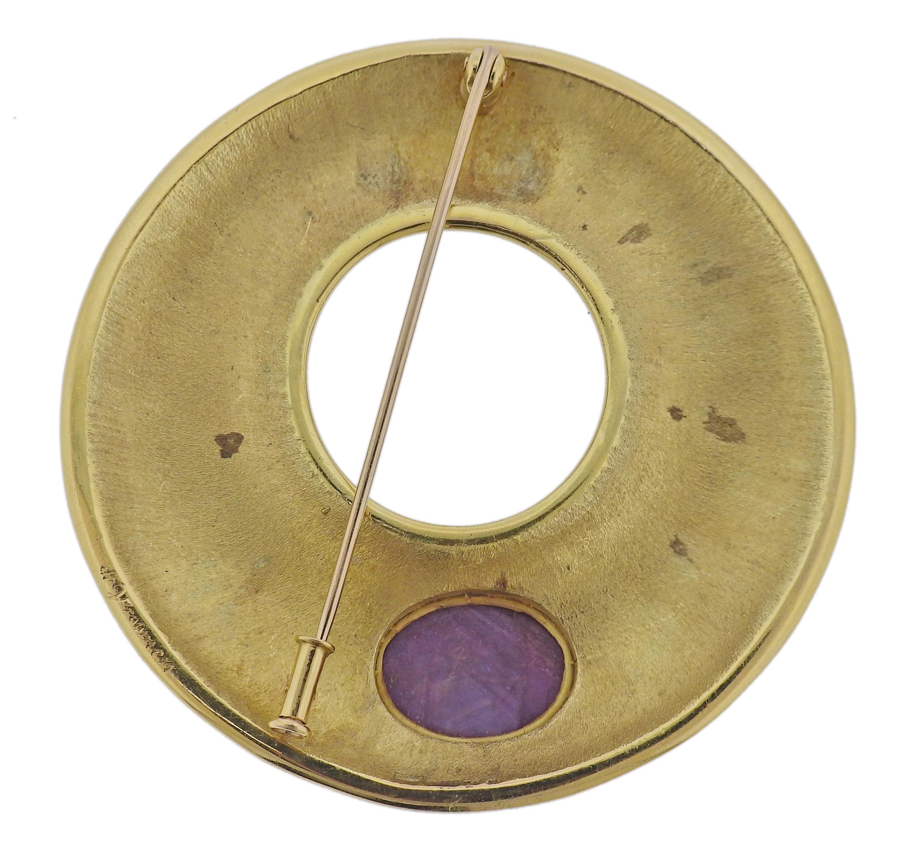 Large 18k gold brooch by Leo de Vroomen, decorated with enamel and 14.8mm x 11.2mm ruby cabochon. Brooch is 58mm in diameter. Marked: LDV English marks. Weight - 51.8 grams.