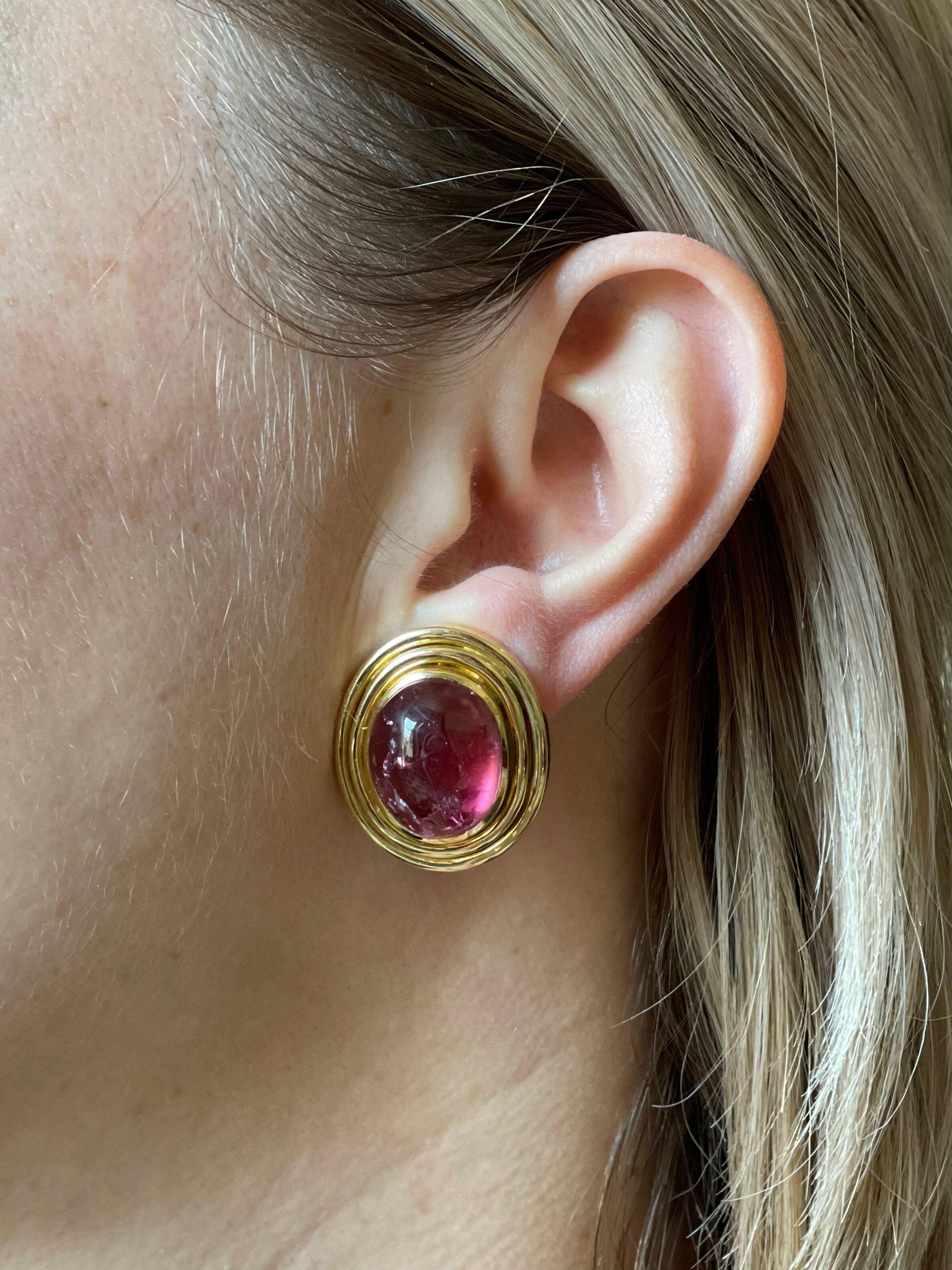 Pair of large 18k gold earrings by Leo de Vroomen, set with two oval pink tourmaline cabochons - measuring approx. 17 x 14 x 10mm each. The earrings are 1 1/16