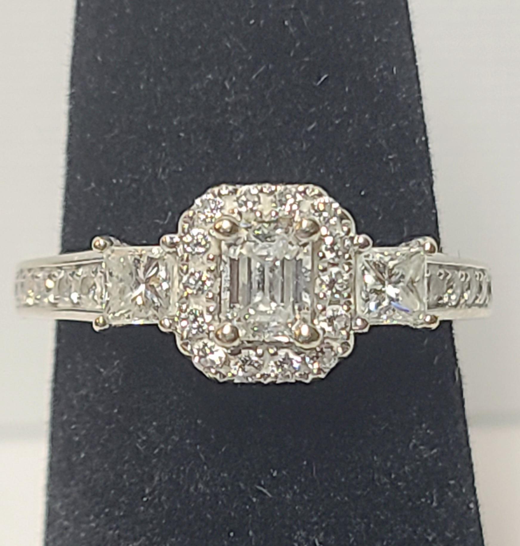 Celebrate tomorrow, today, and beyond with this brightly polished 14k white gold engagement ring, featuring a stunning interplay of mixed-cut diamonds in a breathtaking design with the trademark LEO DIAMOND brilliance and fire. 

An emerald cut