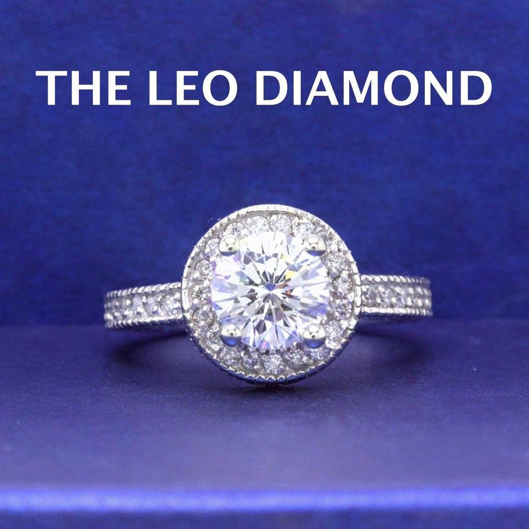 THE LEO DIAMOND 
Style:  Halo Diamond Pave Design
Serial Number:  LEO 034650
Certificate:  IGI # 31293273
Metal: 14KT White Gold
Size:  4.75 - Sizable
Total Carat Weight:  1.62 TCW
Diamond Shape:  Leo Round
Description:  Center:  1.02 CTS I Color