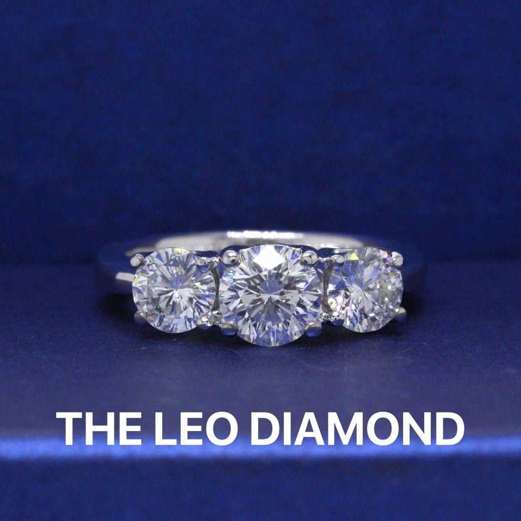 THE LEO DIAMOND 
Style:  Three - Stone Design
Serial Number:  LEO 187861
Certificate:  IGI # 3149349U
Metal: 14KT White Gold
Size:  4.5 - Sizable 
Total Carat Weight:  1.51 TCW
Diamond Shape:  Leo Round
Description:  Center:  0.71 CTS F-G Color