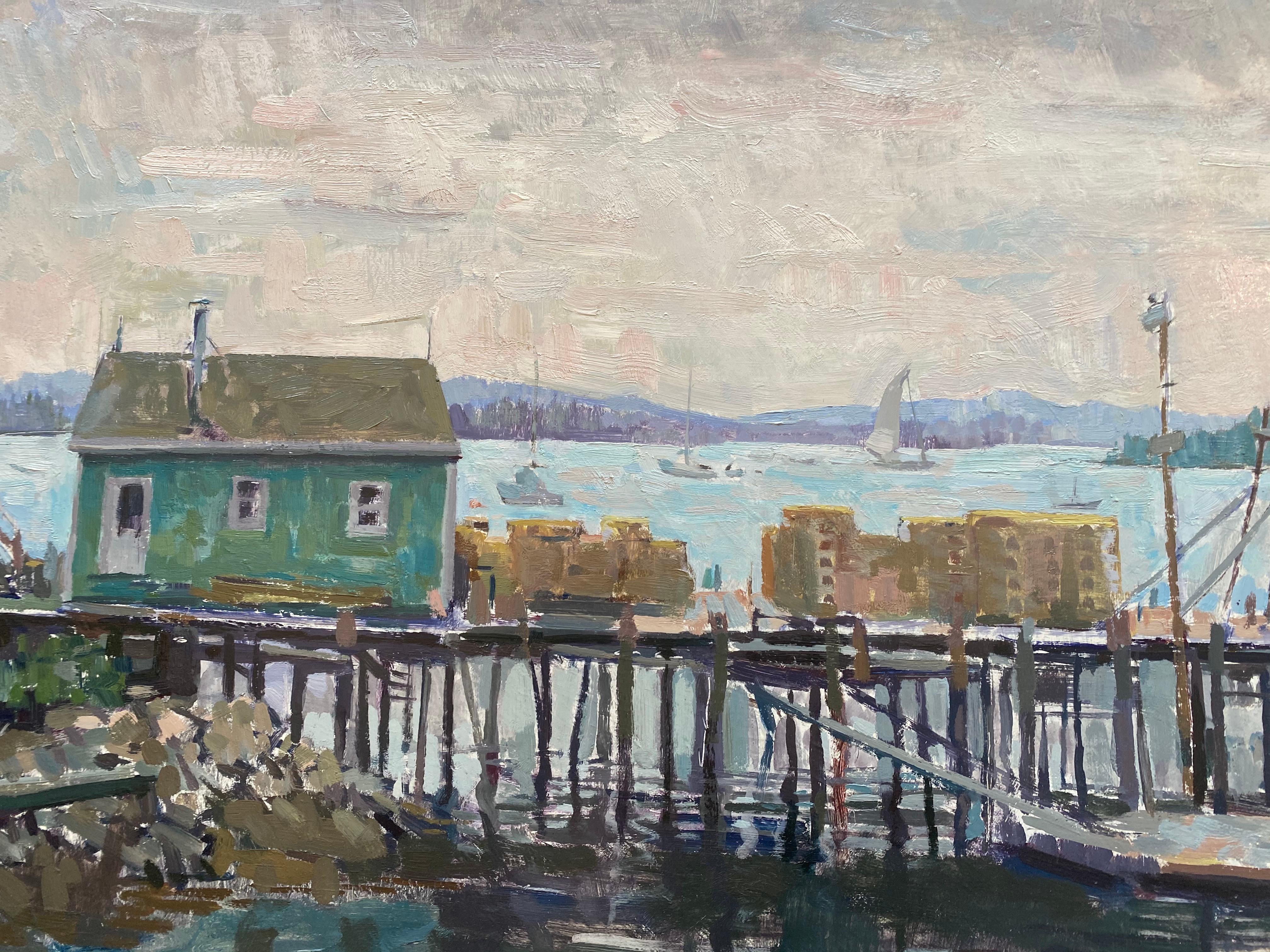 Painted en plein air, in the style of contemporary impressionism. An old dock jutts out from shore, into the body of water. A single blue structure floats atop the edge of the dock. Stacks of boxes, or lobster traps sit atop.Boats float in the
