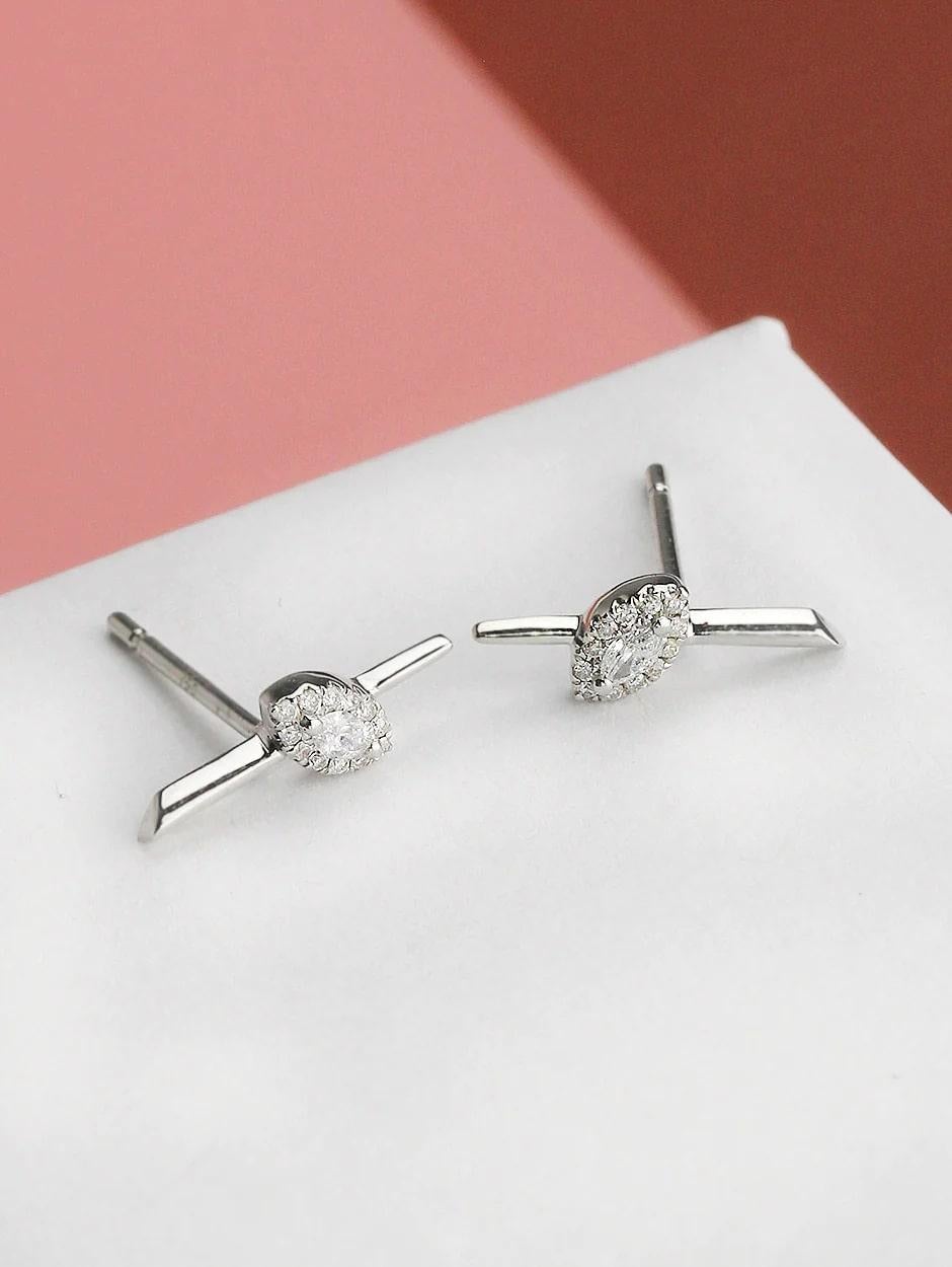 Simple micro pave and marquise white diamond bar earring, all with a high polish finish. Available in 18K White Gold.

Earring Information
Diamond Type : Natural Diamond
Metal : 18K
Metal Color : White Gold
Diamond Carat Weight : 0.08ttcw
Marquise