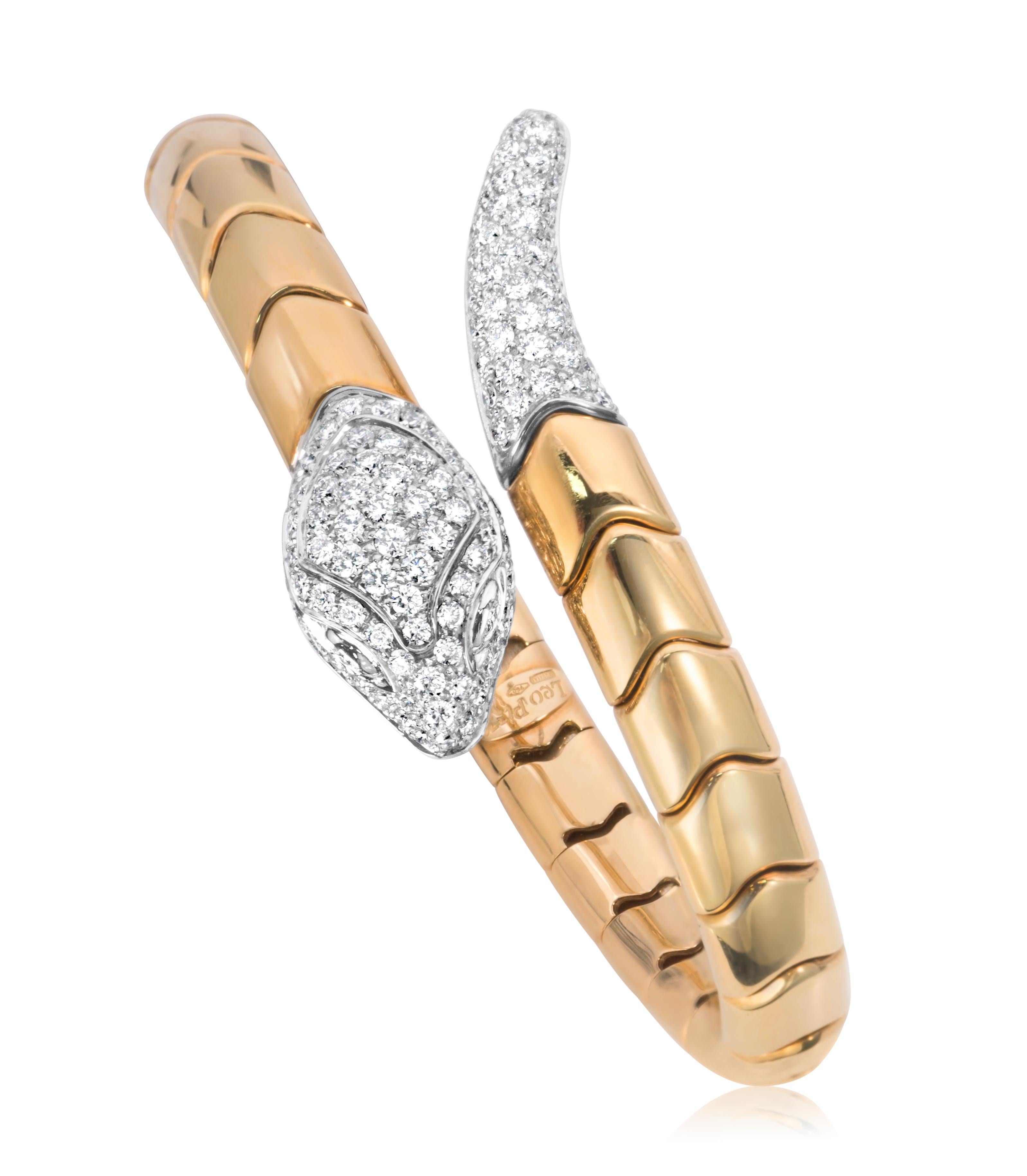 A unique bangle bracelet created by Leo Pizzo, featuring a serpentine motif with pavé set round brilliant cut diamonds weighing 3.48 carats total, set on 18K white gold. Finely made with 18K yellow gold, 7 inches in circumference and 61 grams in