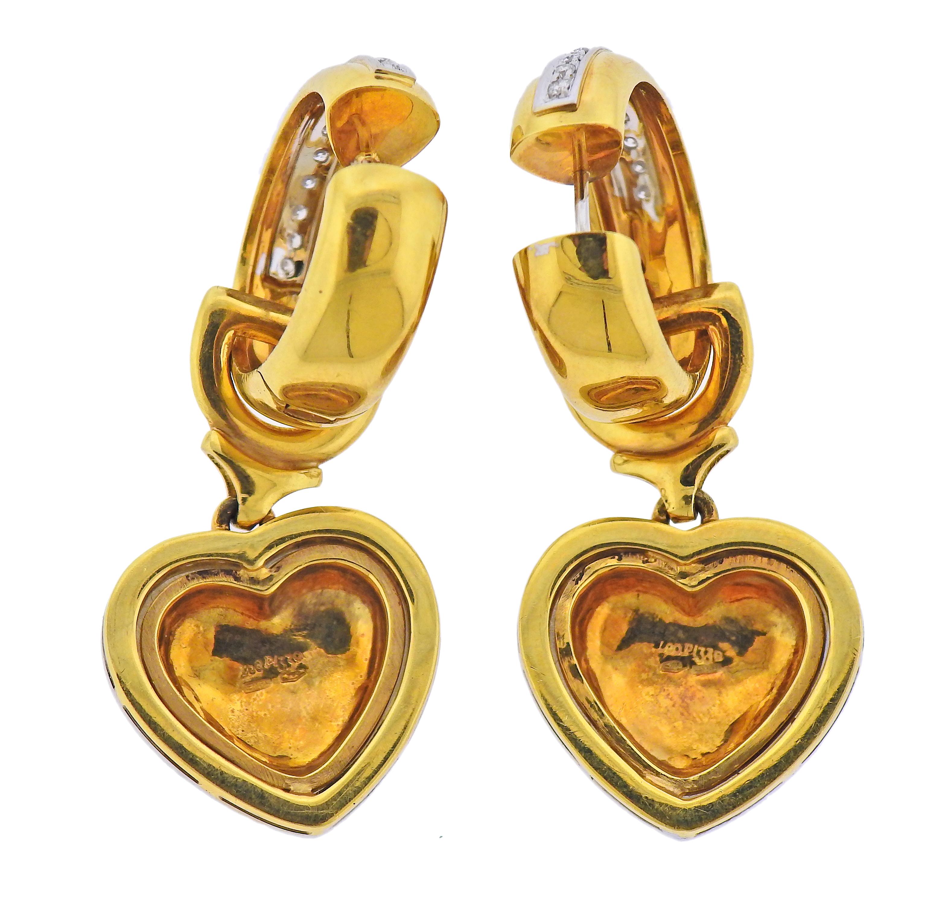 Pair of Loo Pizzo 18k gold hoop earrings with heart drop pendants. Adorned with approx. 1.40ctw in diamonds, hoops are 23mm in diameter x 7.3mm wide. heart drops are 30mm x 22mm. Hearts are removable. Marked: 750, Leo Pizzo, Italian mark.  Weight -