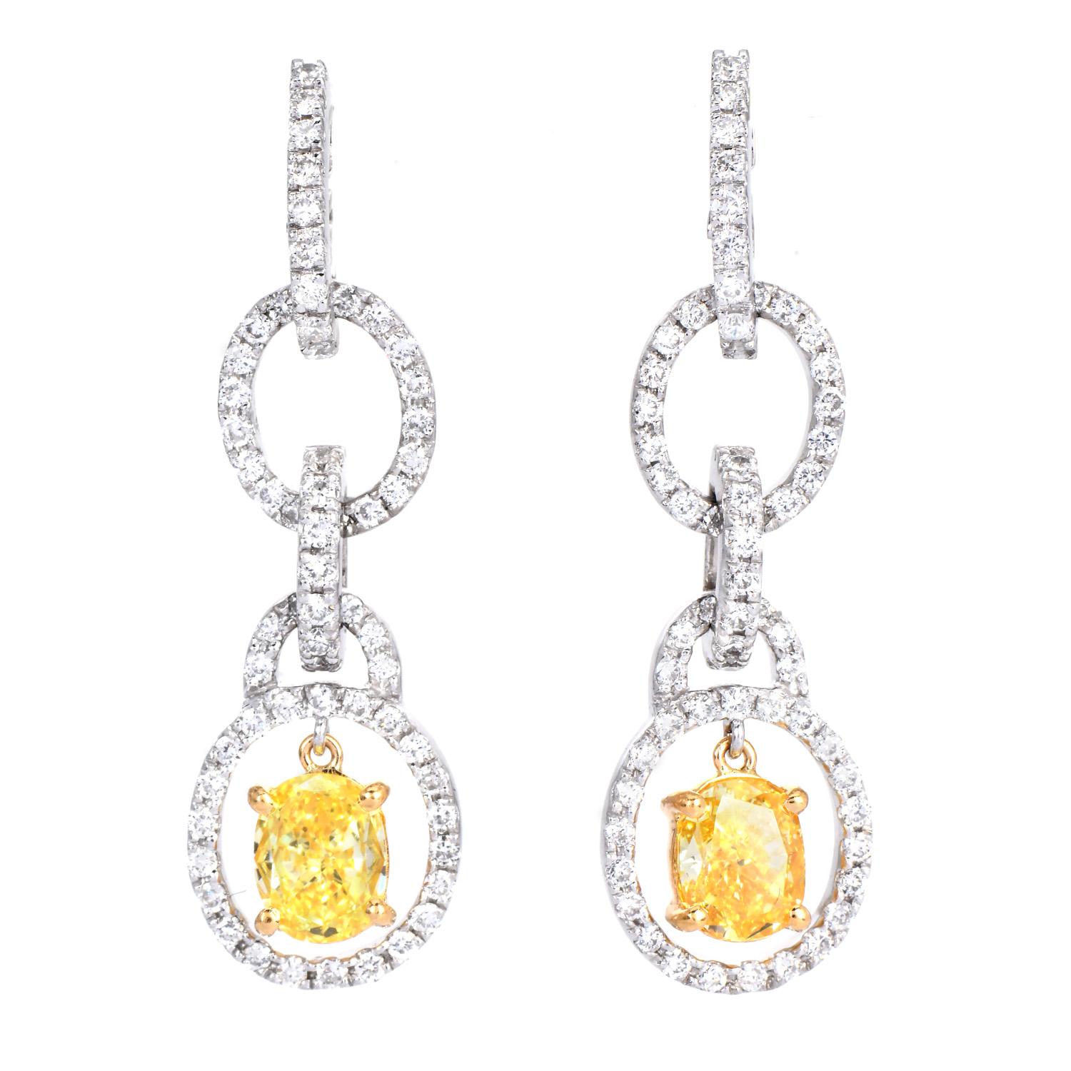 Shine with these Designer Leo Pizzo Natural fancy yellow Diamond Dangel earrings are crafted in Platinum and 18k yellow gold details. They are centered with 2 genuine oval cut fancy yellow Diamonds approx: 1.50 carats in total, Natural Fancy intense