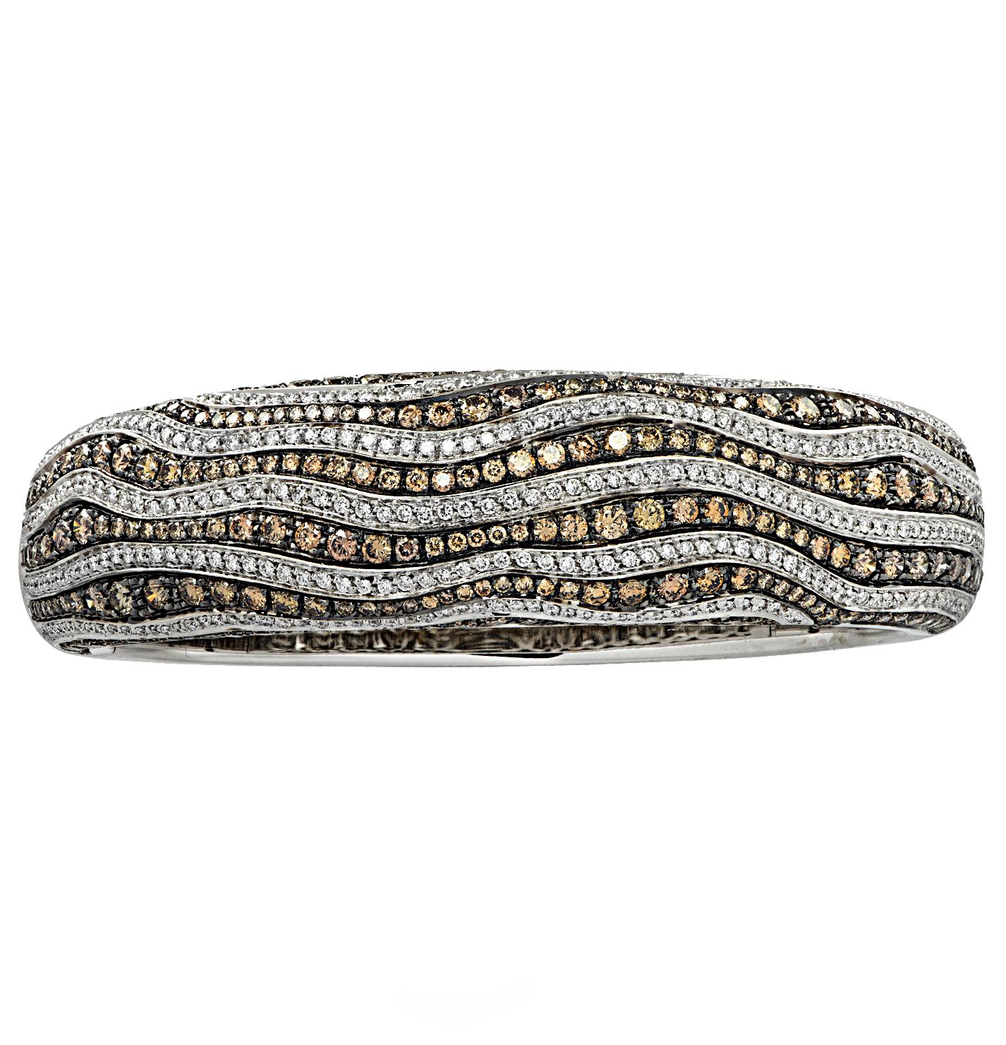 Stunning Leo Pizzo bangle bracelet crafted in 18 karat white gold with black rhodium featuring 630 mixed brown and white diamonds weighing approximately 7 carats total. 350 round brilliant cut diamonds weighing approximately 2 carats total, G color,