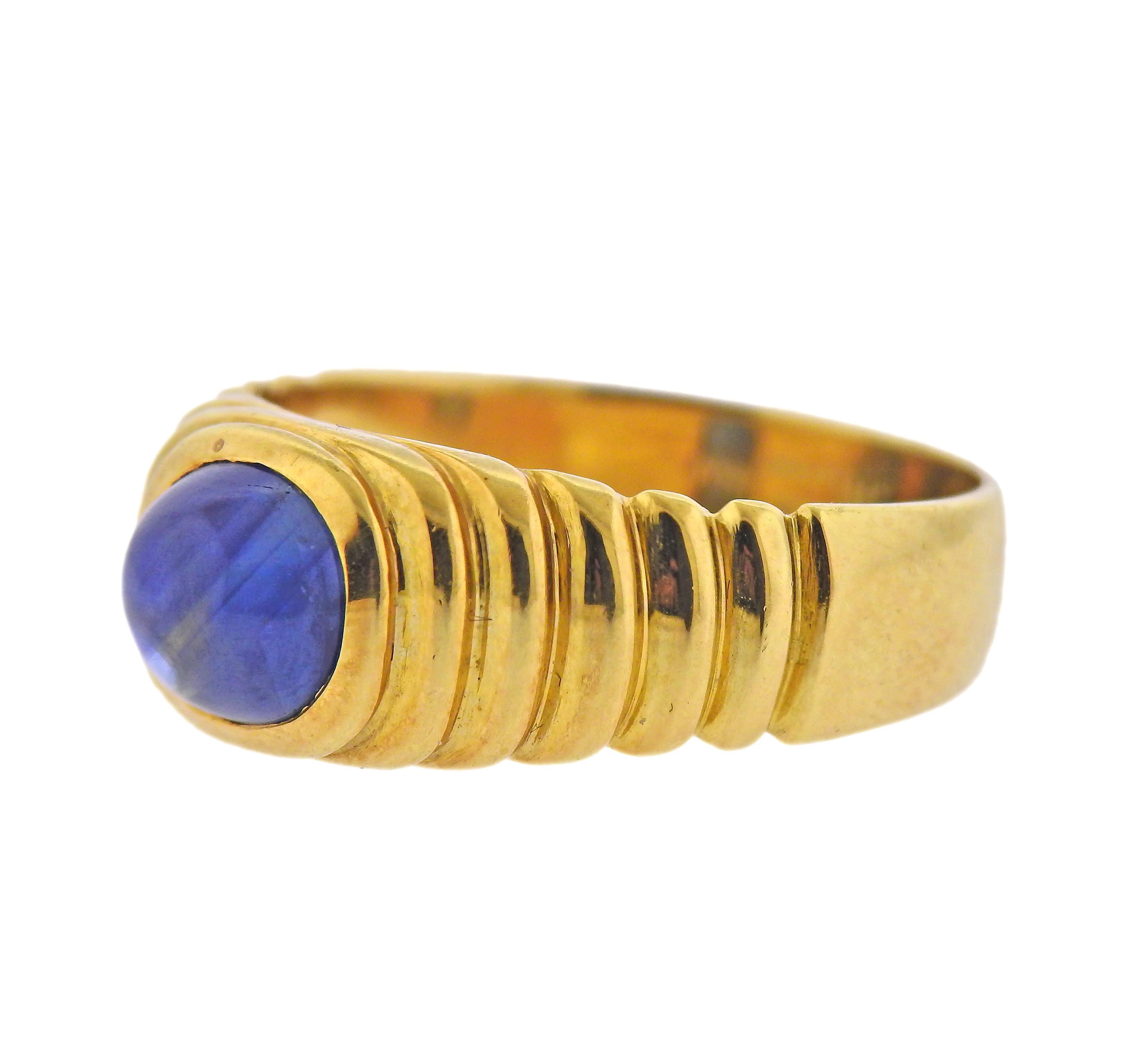 18k yellow gold ring by Leo Pizzo, with 6.9mm x 8mm sapphire cabochon. Ring size - 9, ring top is 9mm wide. Marked: Leo Pizzo, 750, Italian mark. Weight - 7.6 grams. 