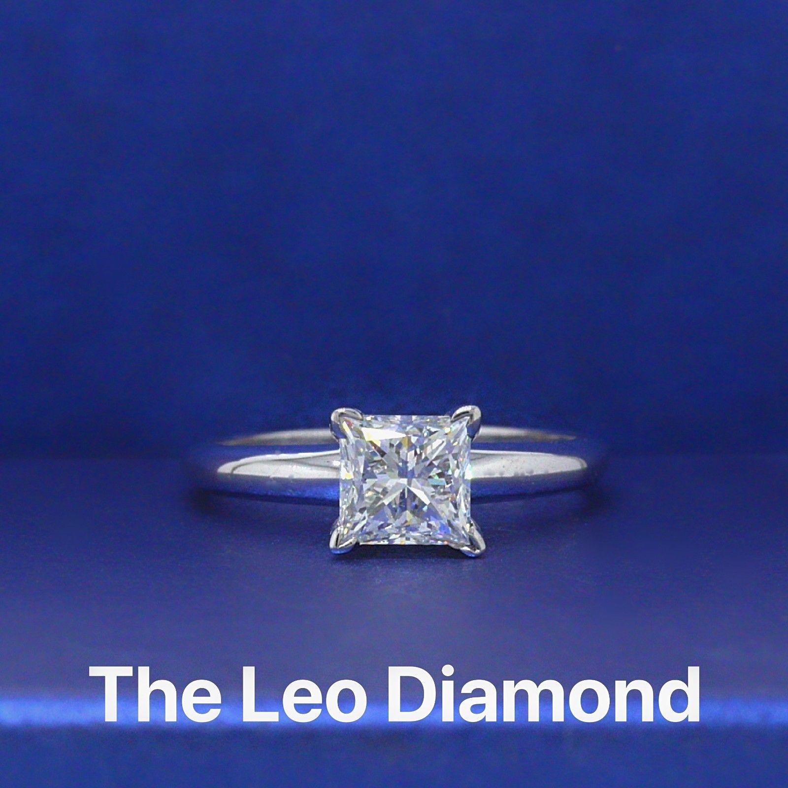 LEO DIAMONDS
Style: 4 Prong Solitaire
Serial Number: LEO 2081236S
Metal: 14KT White Gold
Size:  5 (sizable)
Total Carat Weight: 0.98 CTS
Diamond Shape: LEO Princess
Diamond Color & Clarity: I / SI1
Comments:  Diamond is Laser Inscribed on girdle