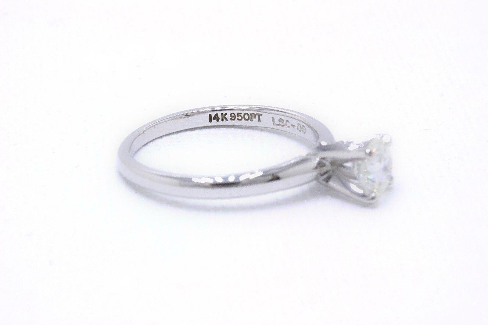 Women's Leo Round Diamond Solitaire Engagement Ring 0.69 Carat G SI2 14 Karat White Gold For Sale