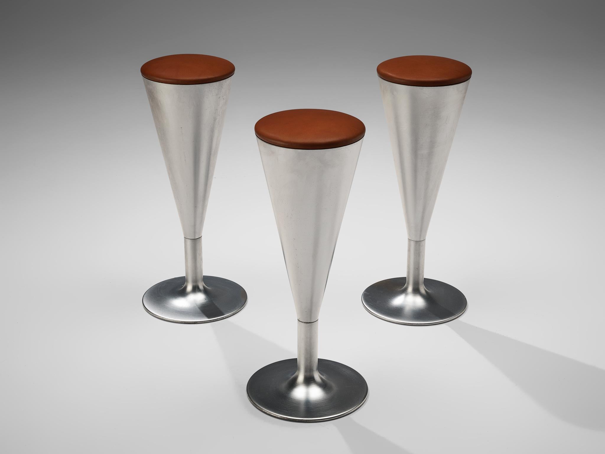 Leo thafvelin for Johanson design, set of three bar stools, patinated steel, leather, Sweden, 1960s 

This eccentric set of three bar stools is designed by the Swedish designer Leo Thafvelin. The stools are executed in a thick cognac leather for