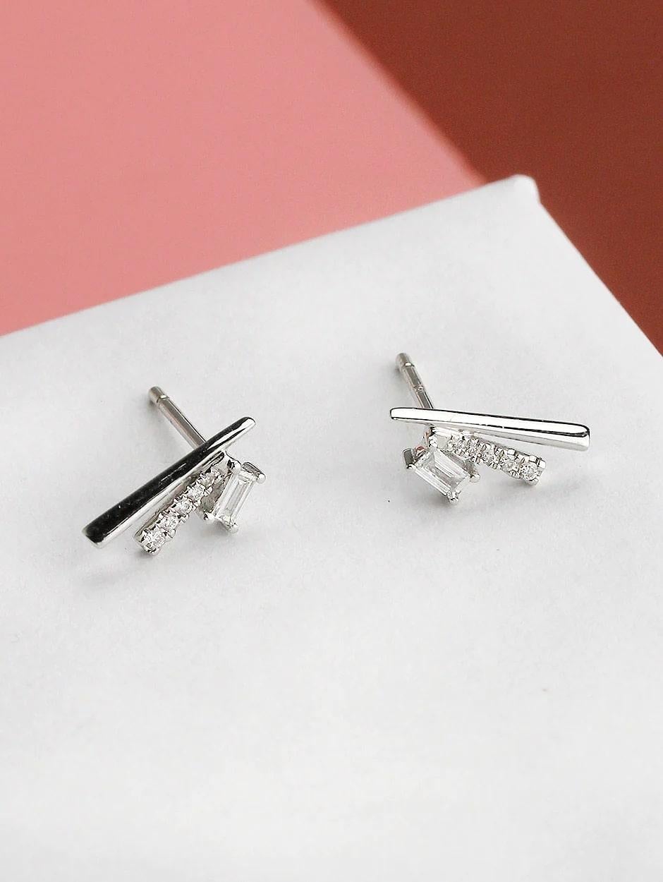 Combination of micro pave and baguette white diamond bar earring, all with a high polish finish. Available in 18K White Gold.

Earring Information
Diamond Type : Natural Diamond
Metal : 18K
Metal Color : White Gold
Diamond Carat Weight :