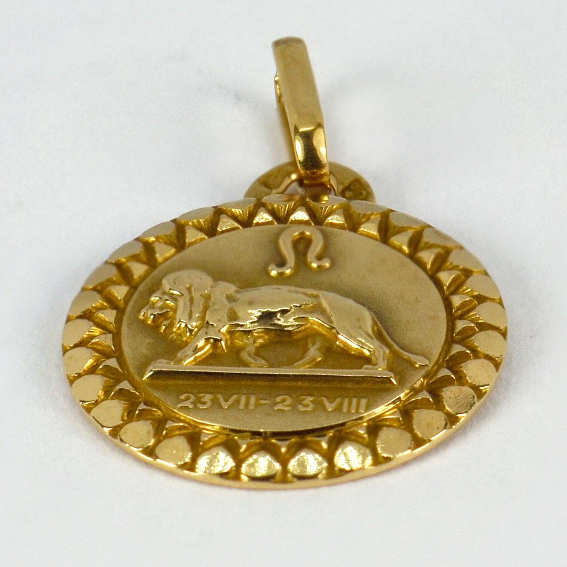 An 18 karat (18K) yellow gold charm pendant designed as the zodiac symbol for Leo, depicting a lion, the astrological symbol for Leo and the dates 23 July - 23 August. Stamped with the eagle’s head for French manufacture and 18 karat gold with an