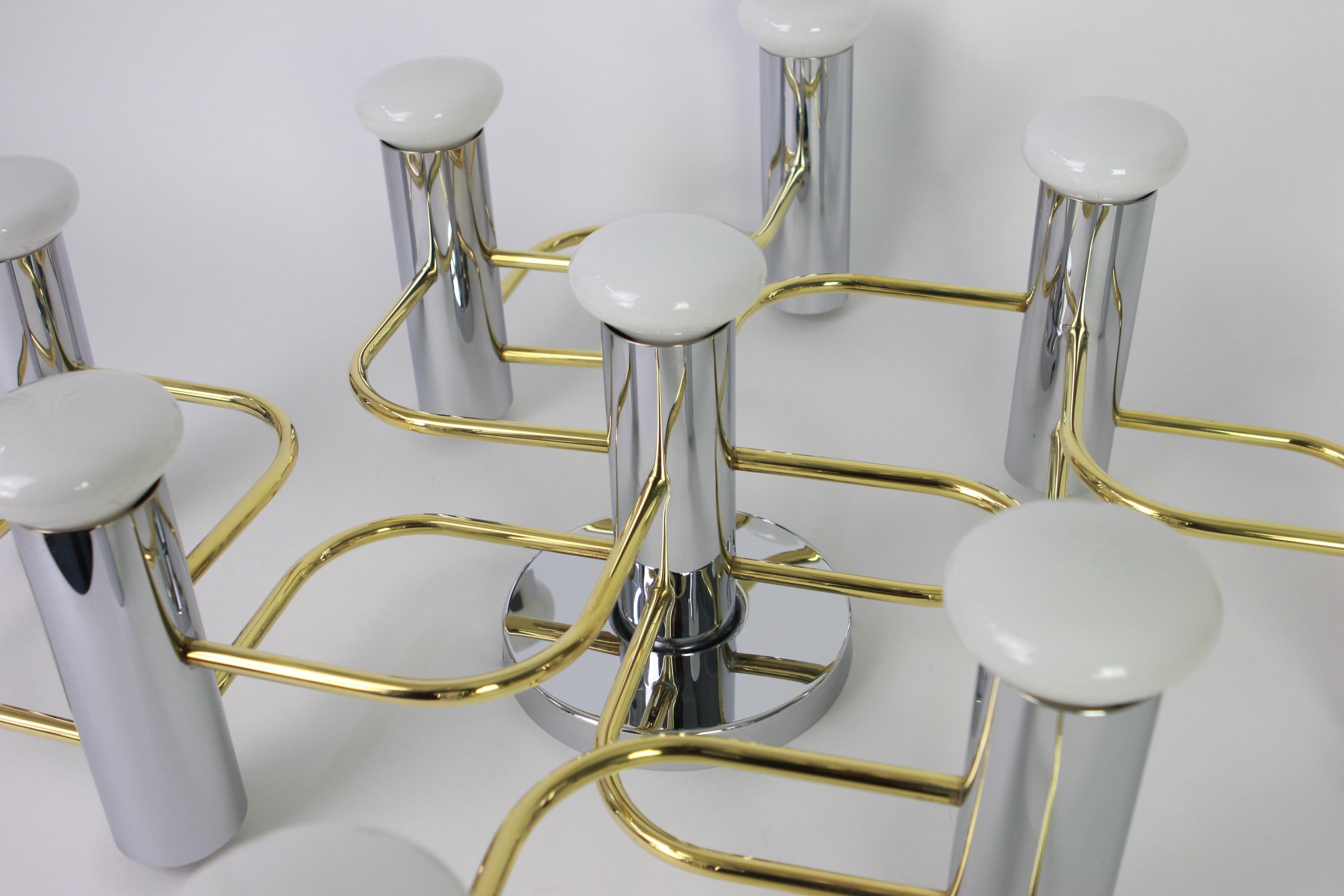 Stunning nine-light flushmount light fixture in chrome and brass, can be used as wall or ceiling light.
Design: Sciolari
Sockets: 9 x E14 small bulbs - max 40 watt each // compatible also with the US / UK/.. Standards.
Very good condition.

 2 items