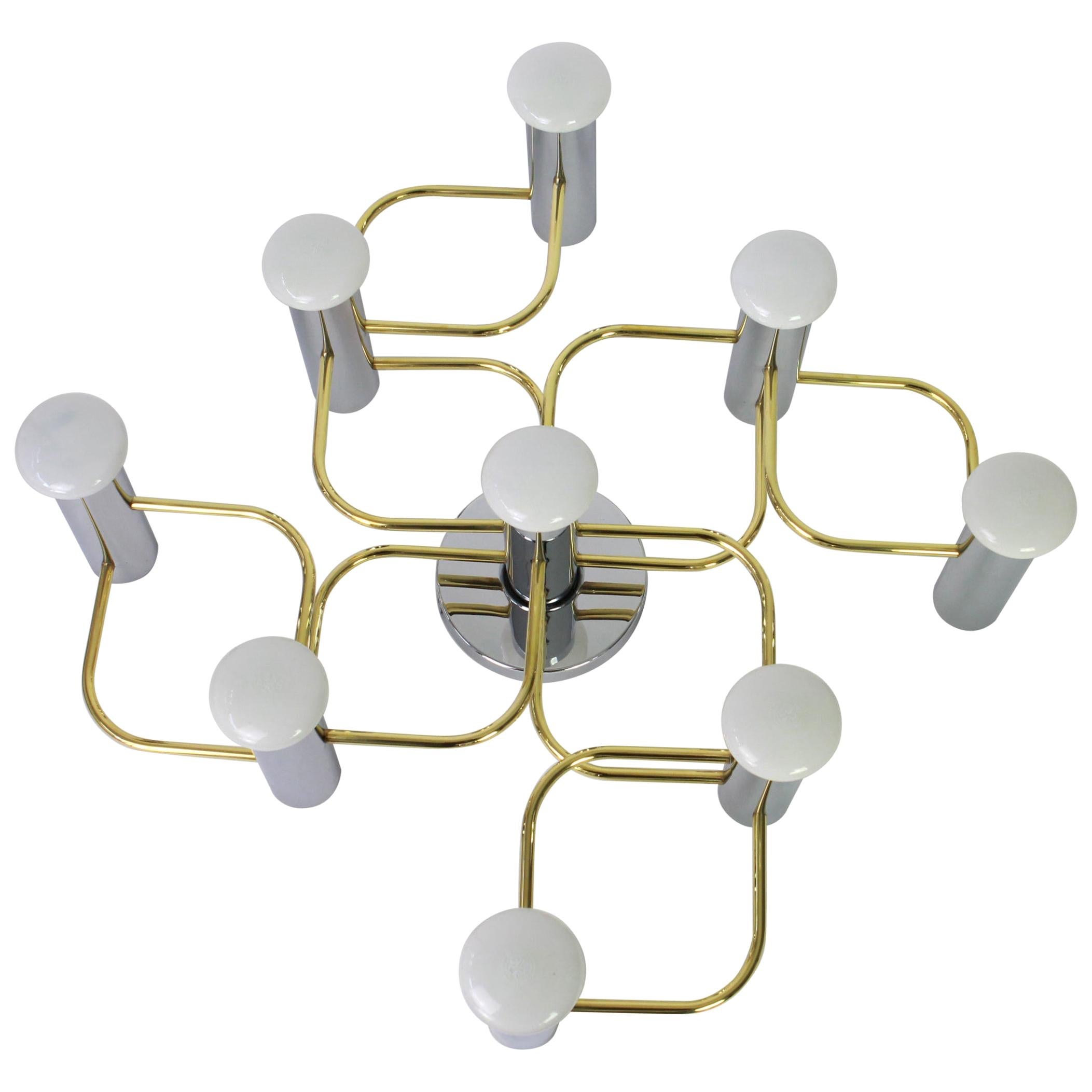 Stunning nine-light flushmount light fixture in chrome and brass, can be used as wall or ceiling light.
Design: Sciolari
Sockets: 9 x E14 small bulbs - max 40 watt each
Light bulbs are not included. It is possible to install this fixture in all