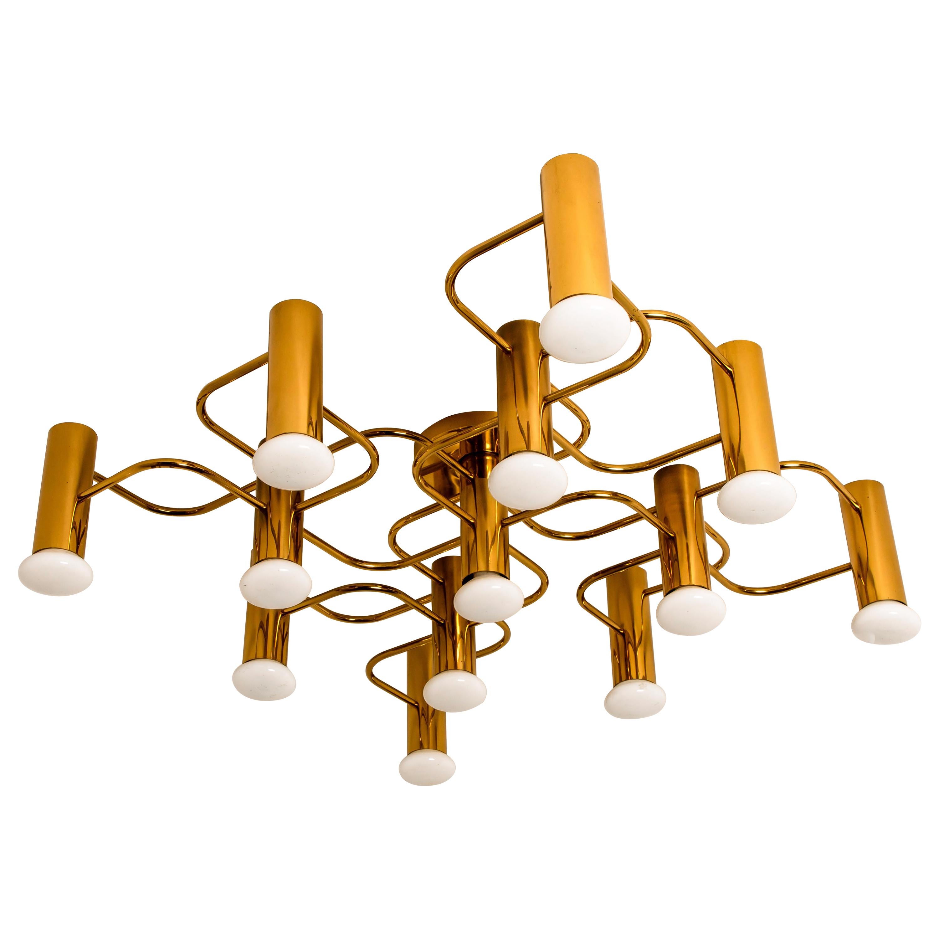 Gorgeous Sciolari style ceiling or wall flush mount by Leola. Made with solid polished brass, Germany, 1960s. 

Can be used as ceiling flushmount or as expressive wall light.

The light fixture requires 13 E14 candelabra bulbs, each up to 40