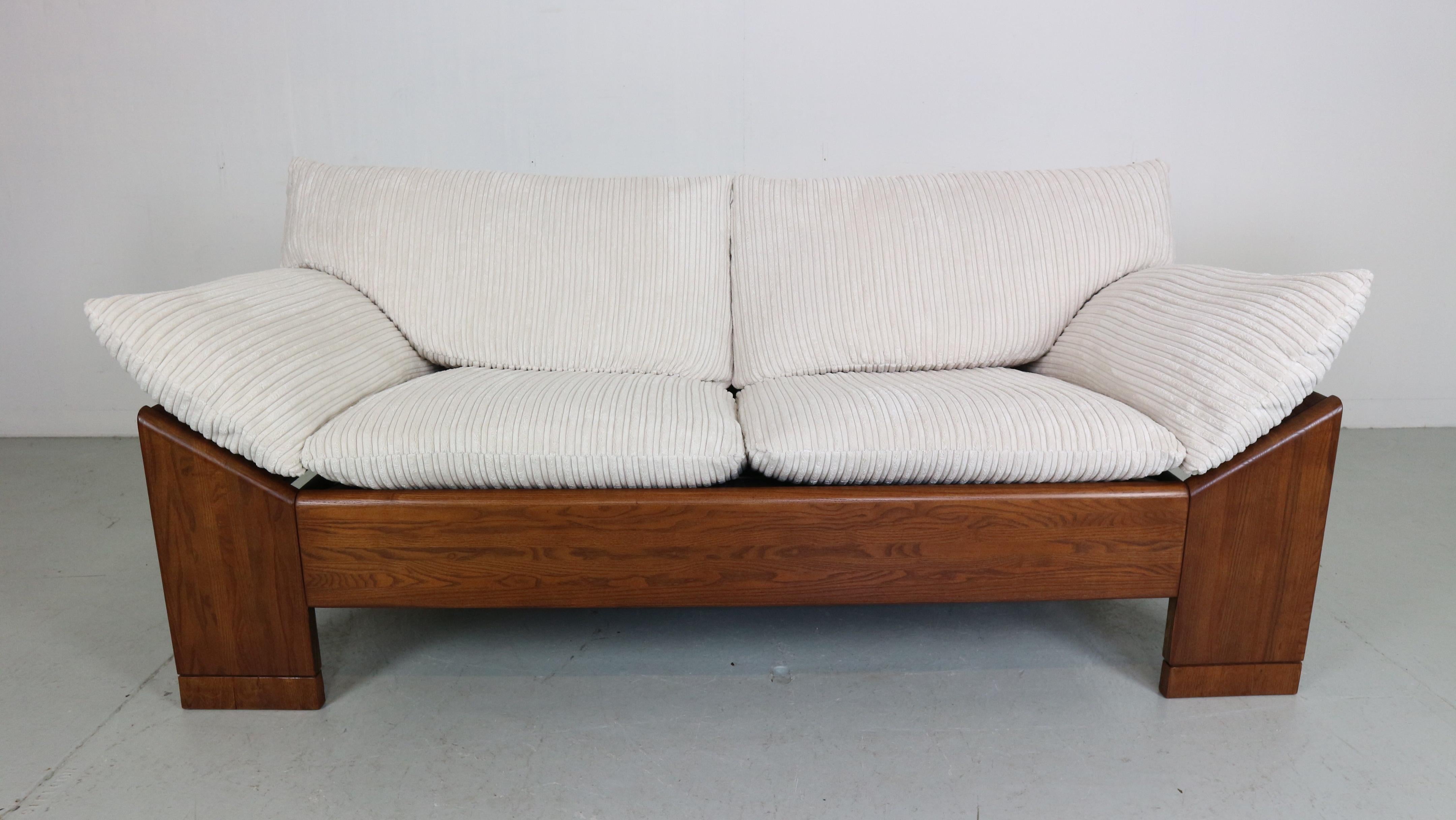 Mid-Century Modern period 2 seater sofa or loveseat made of Dutch furniture manufacture Leolux in 1960s period.

High quality sofa has a solid wenge wood frame and newly reupholstered cushions in off white striped velvet fabric.
Very comfortable