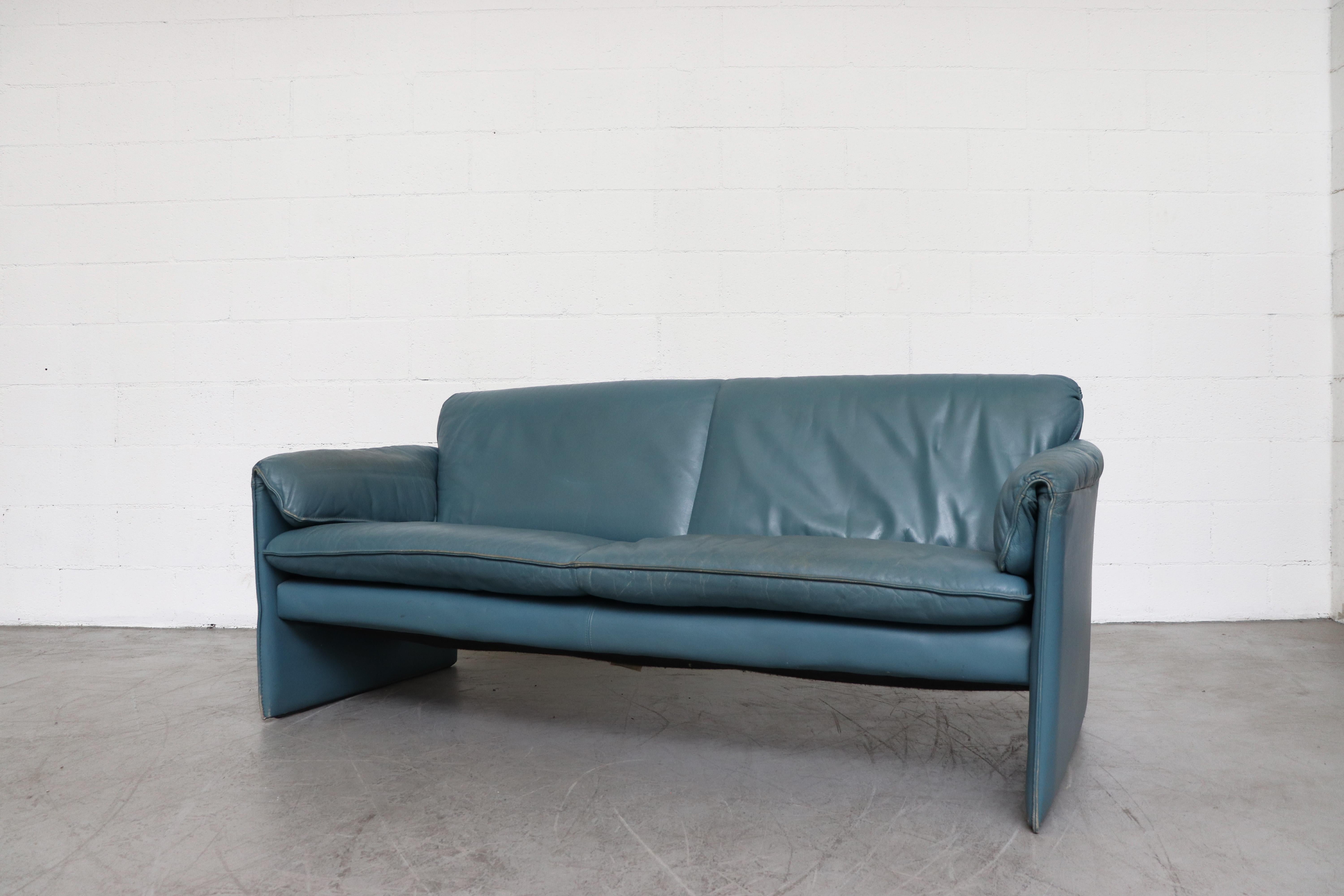 Super cute blue leather 'Bora Bora' 2-seat sofa by Leolux. In original condition with visible signs of wear consistent with its age and use, details in photos.