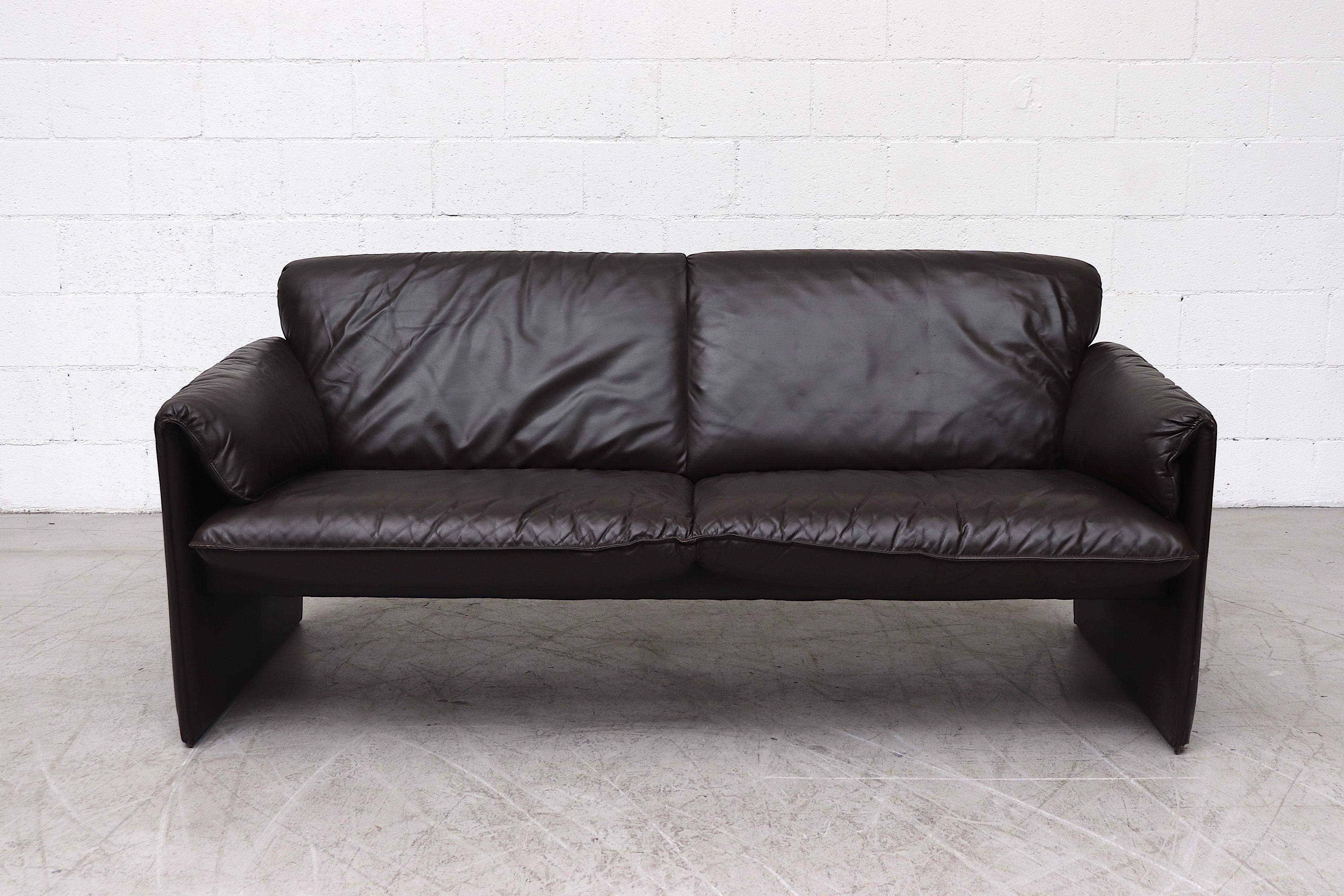 Dark Mocha leather 'Bora Bora' 2-seat sofa by Leolux. In original condition with manufacturer engraving and some visible wear and scratching.