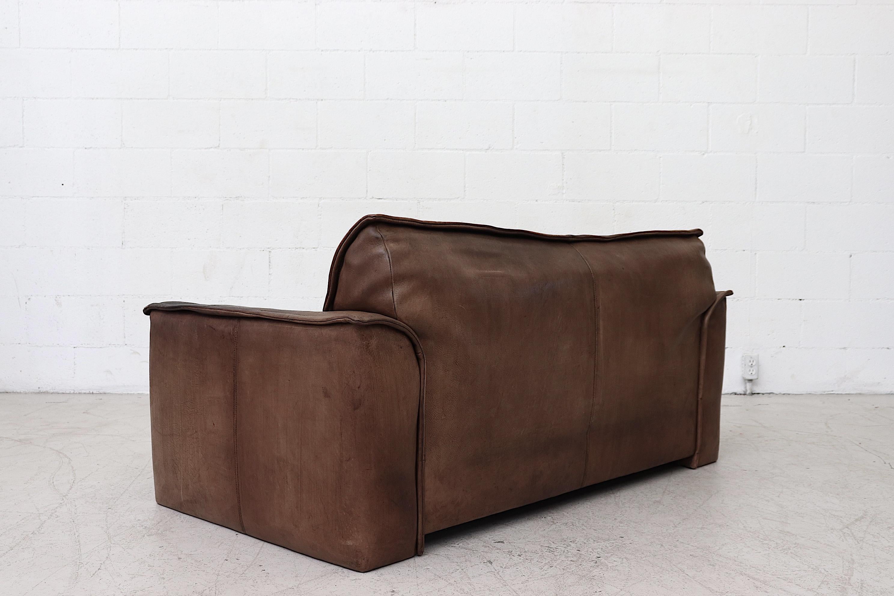 Well worn Leolux Buffalo Leather Love Seat In Good Condition In Los Angeles, CA