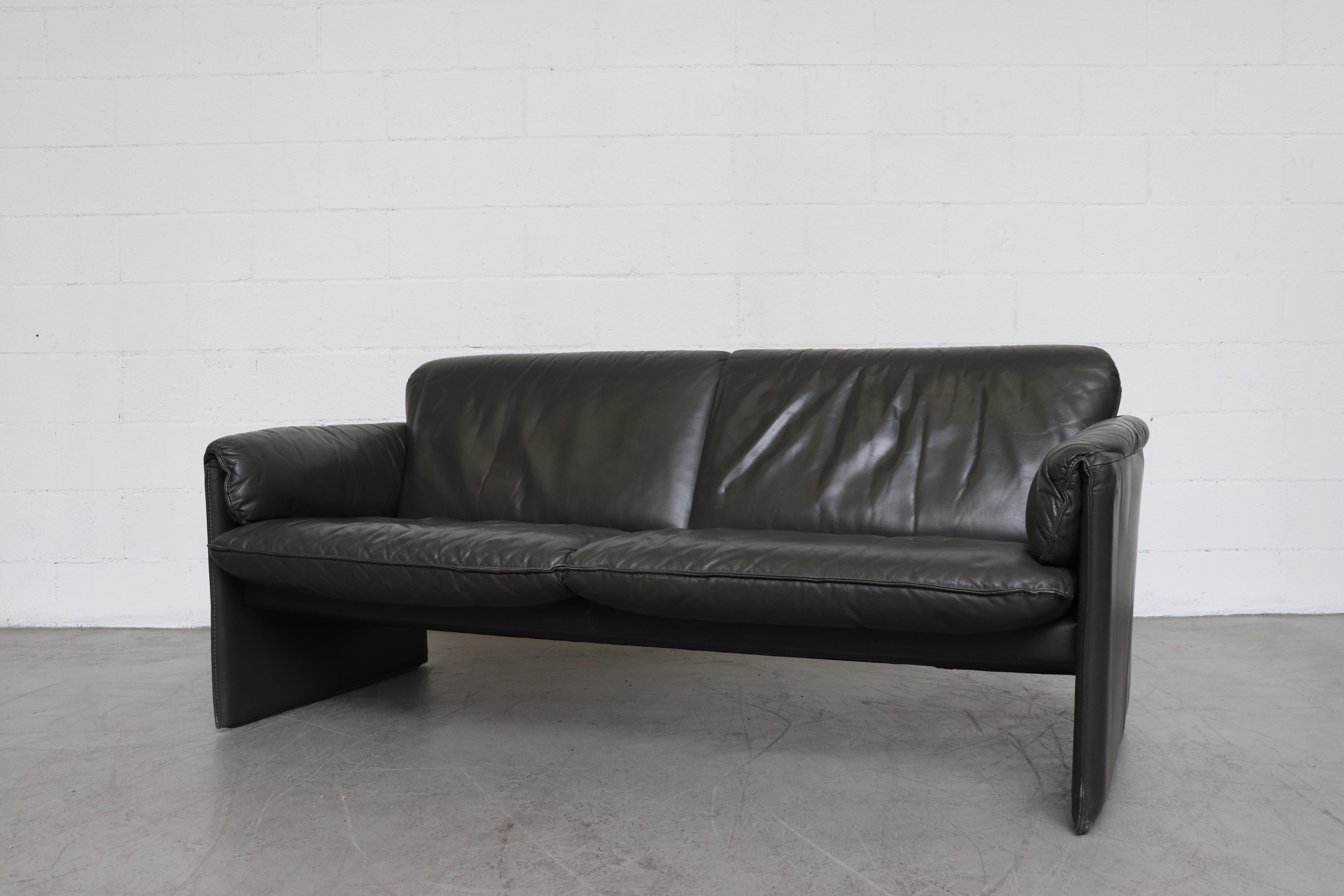 Charcoal grey leather 'Bora Bora' 2-seat sofa by Leolux. In original condition with visible signs of wear consistent with its age and use, other colors in the same style available.