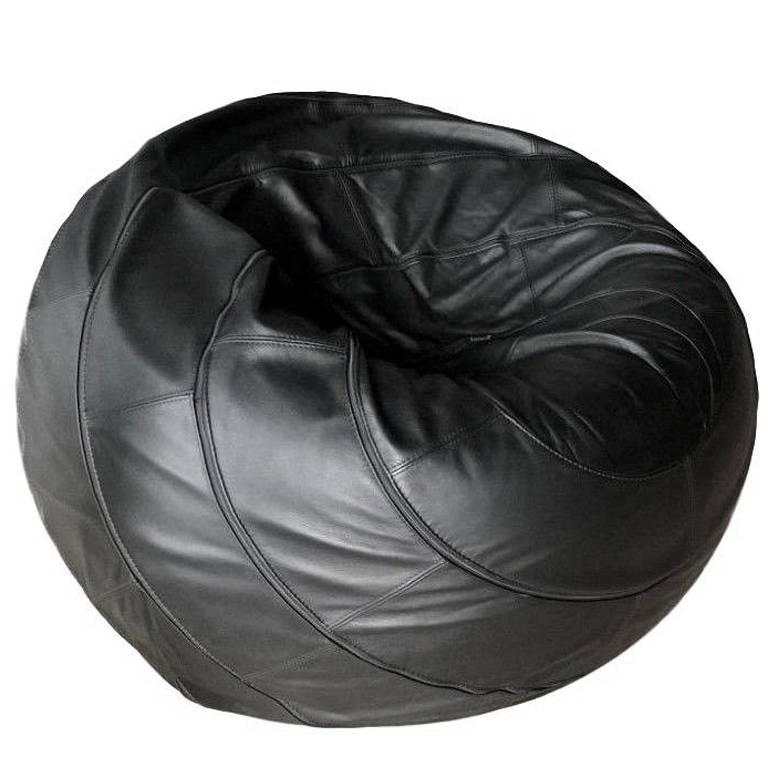 Super rare black leather ball chair by Leolux. Great patchwork leather sculptural chair. Conforms to the body when sat in, and springs back to a sphere when you get up. Great vintage piece. Excellent condition. Original label attached.