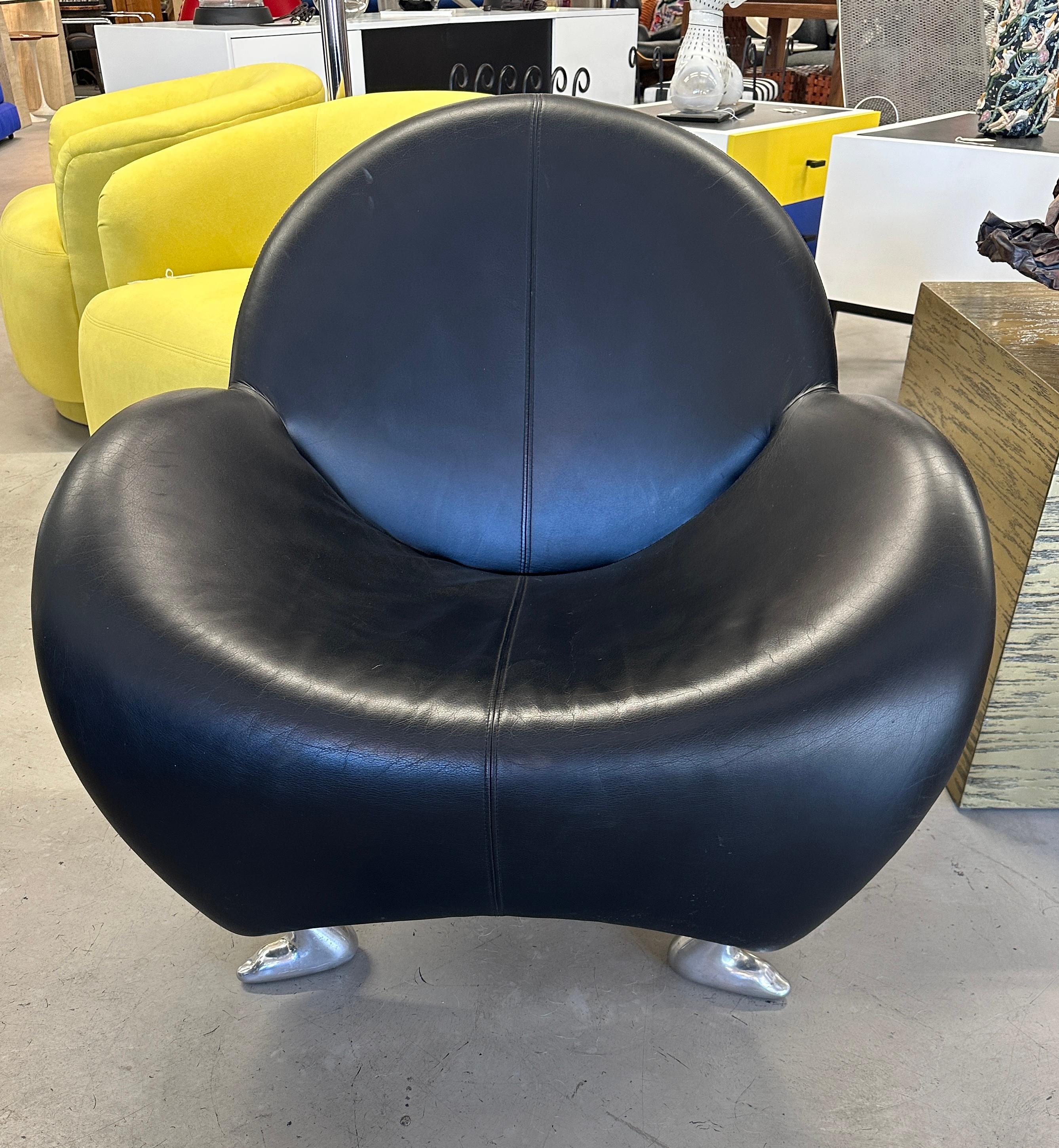 Whimsical wonderful Papageno chair by Leolux of the Netherlands. Great front legs and a wishbone rear leg. In soft black leather. This chair dates from the 1990’s and is in good condition. Minor marks to the legs and some marks to the leather, which