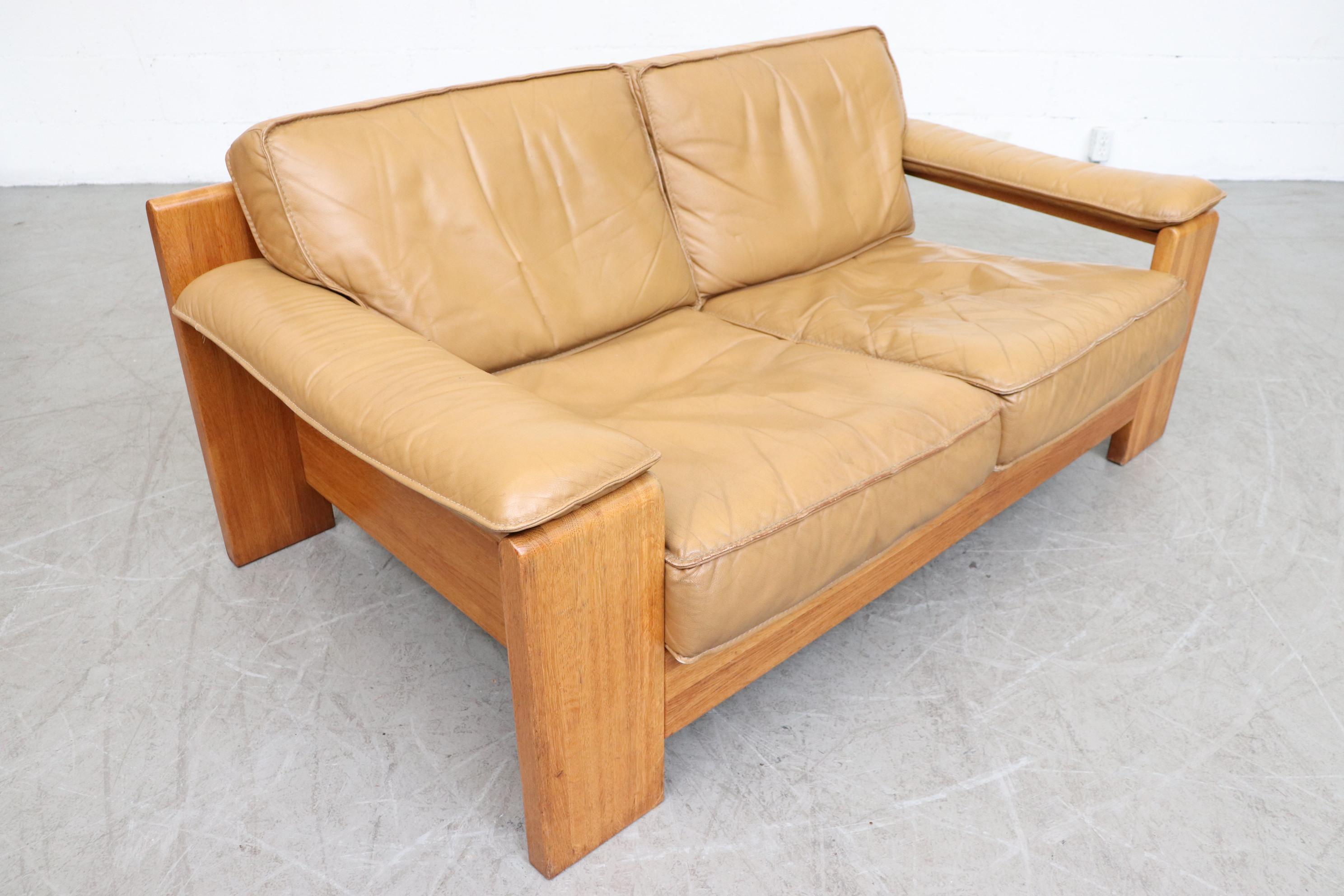 wood and leather loveseat